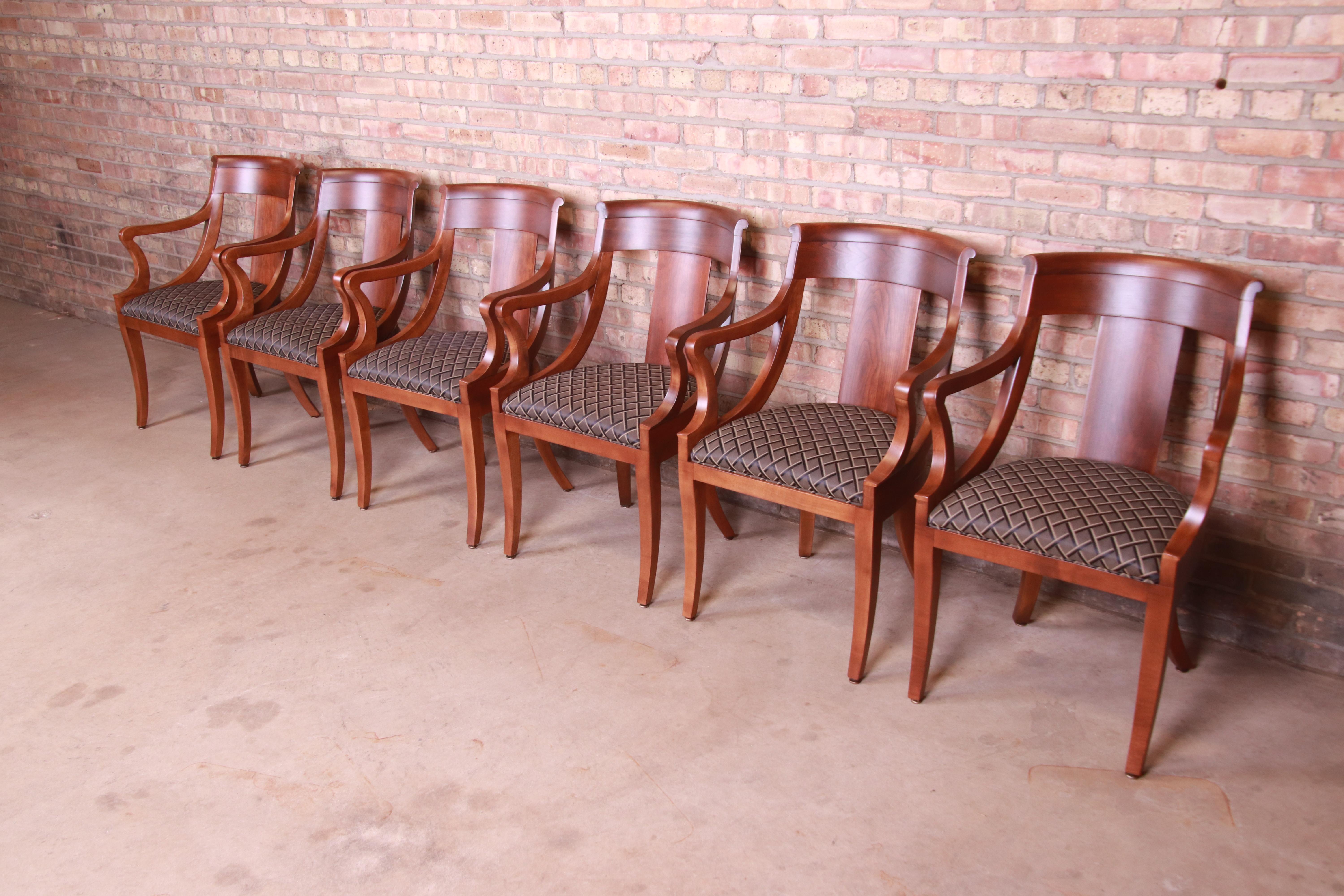 An exceptional set of six Regency or neoclassical style dining chairs

By Baker Furniture

USA, Circa 1980s

Solid cherry wood frames, with upholstered seats.

Measures: 23