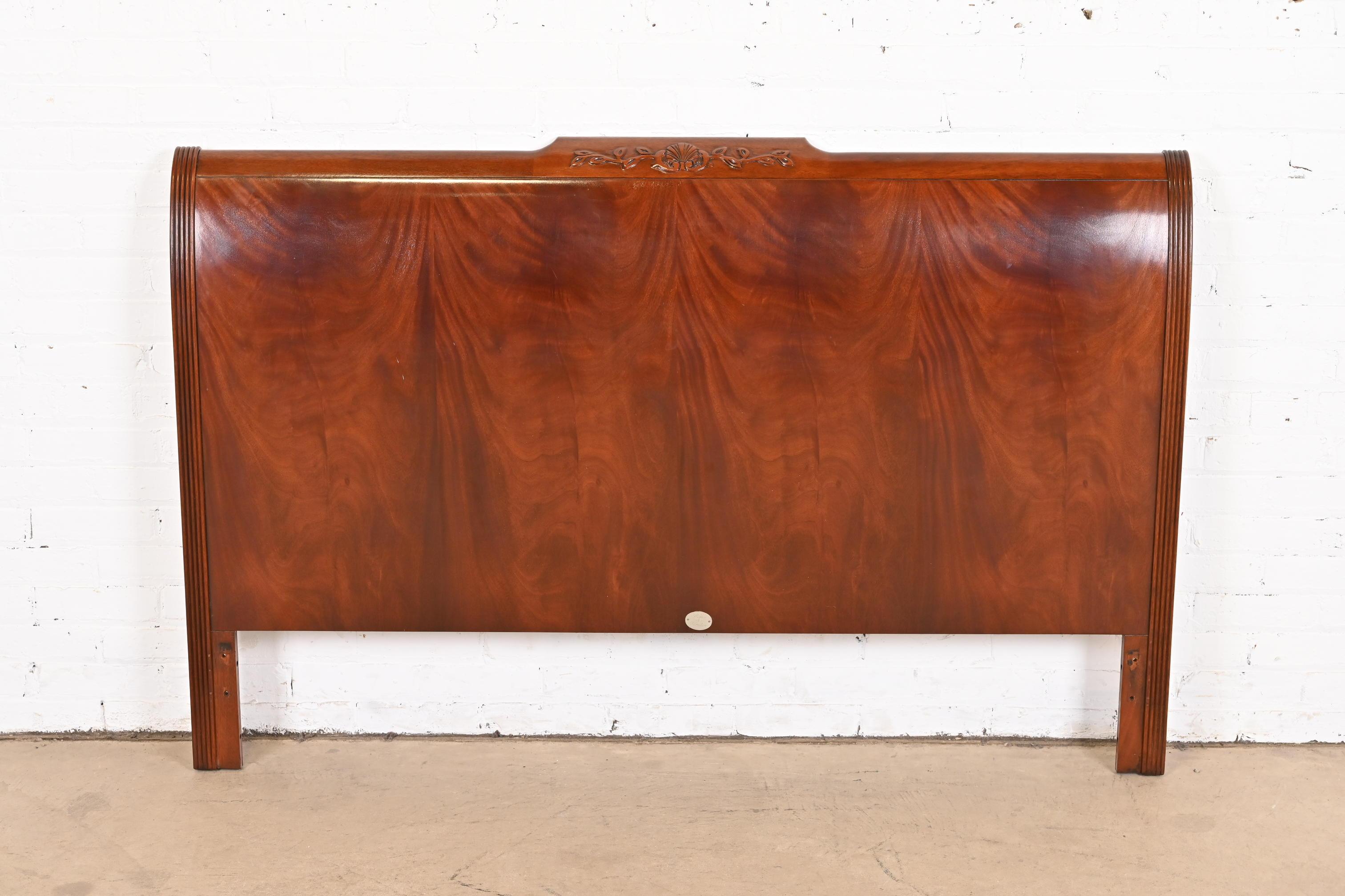 A gorgeous Regency or Louis XVI style queen size headboard

By Baker Furniture

USA, Circa 1980s

Beautiful book-matched flame mahogany, with brass details.

Measures: 62