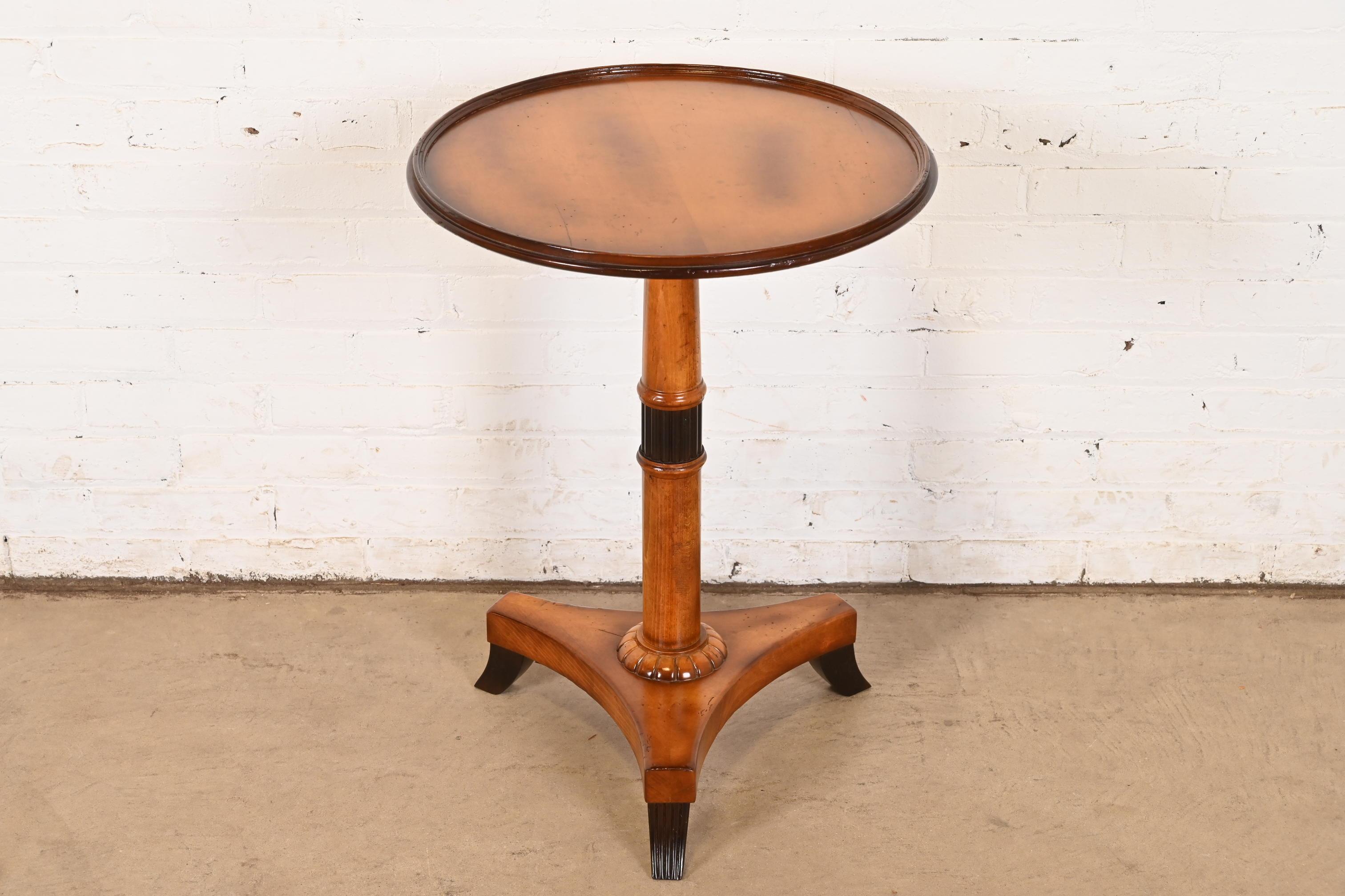 A gorgeous Empire, Regency, or Neoclassical style pedestal tea table, drinks table, or occasional side table

By Baker Furniture, 