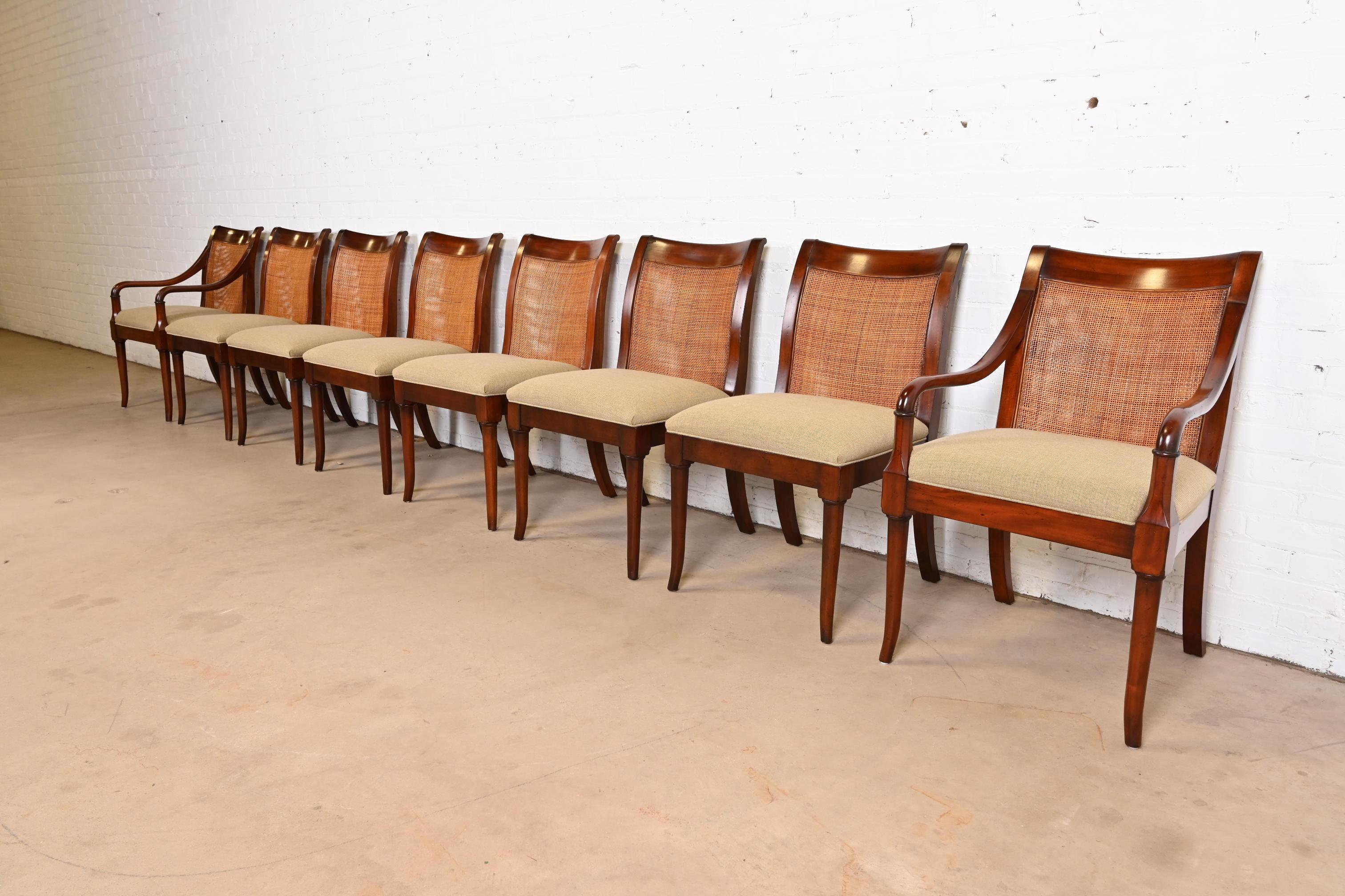 An outstanding set of eight Regency style dining chairs

By Baker Furniture

Indonesia, Circa Early 21st Century

Elegant sculpted mahogany frames, with caned backs, and upholstered seats.

Measures: 
Side Chairs: 21