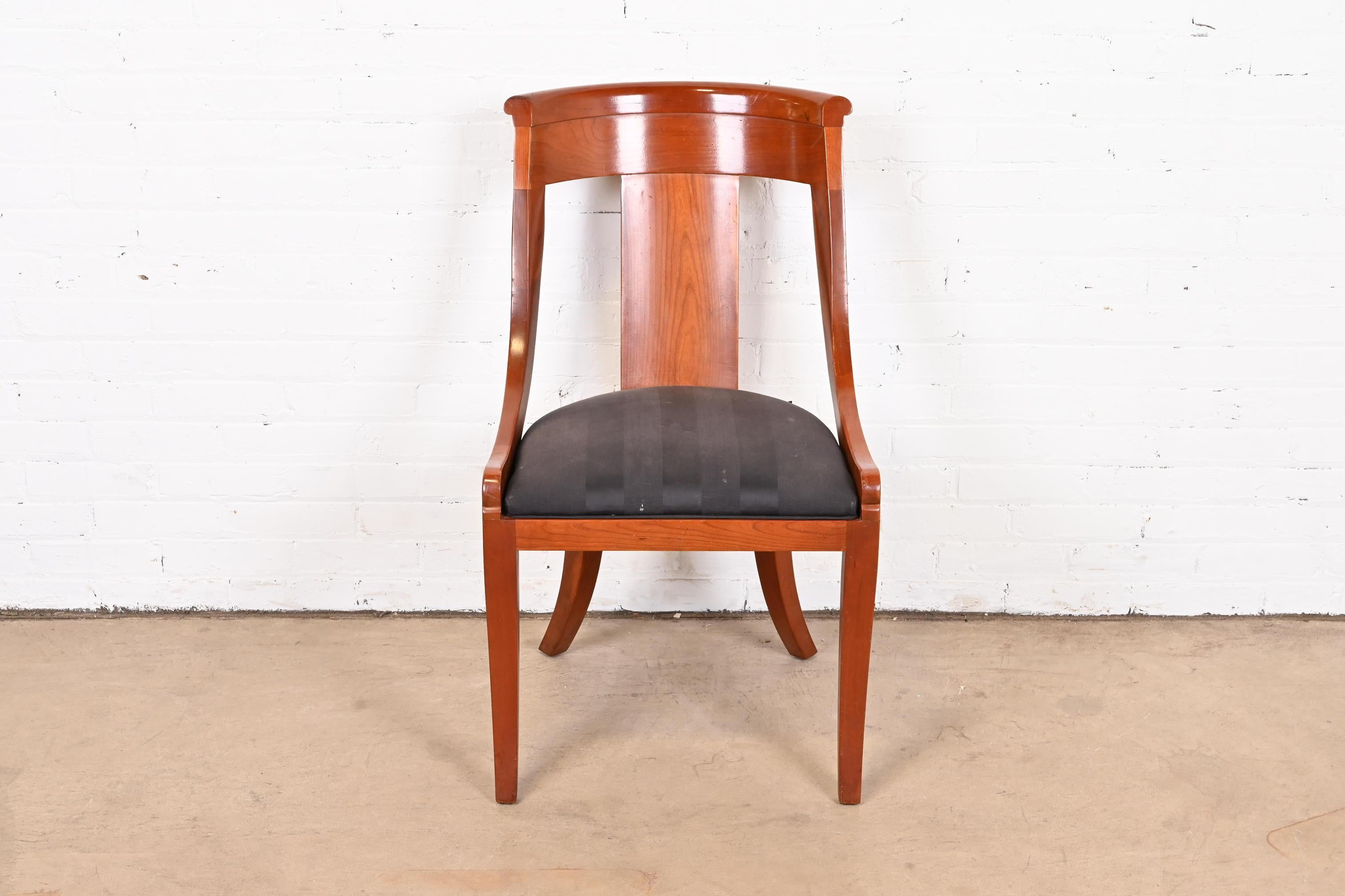 A gorgeous Regency style dining chair or side chair

By Baker Furniture

USA, Circa 1980s

Solid cherry wood frame, with upholstered seat.

Measures: 20.75