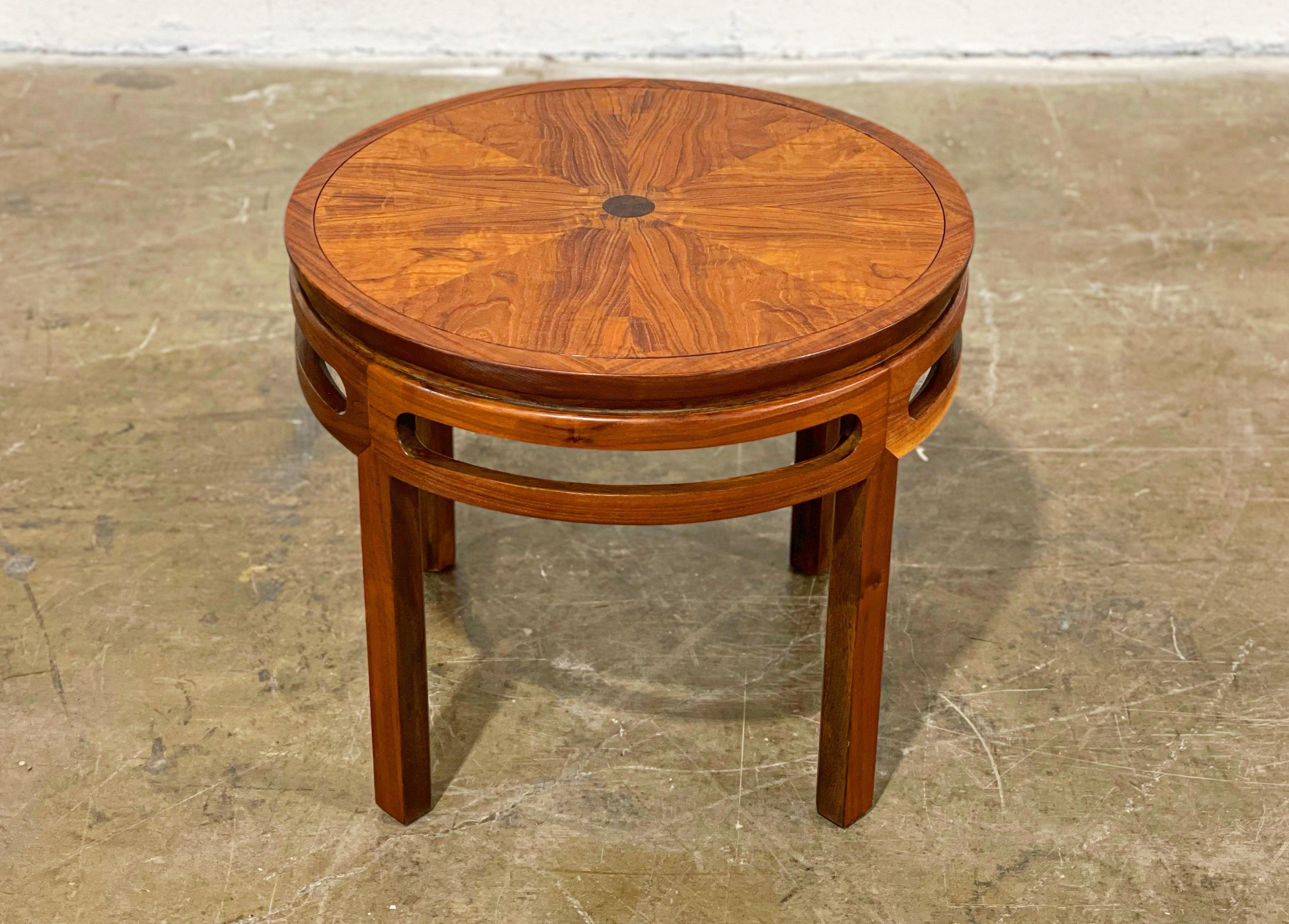 Exquisite round occasional table in book matched walnut with a burled walnut inlay by Michael Taylor for Baker Furniture. Fully restored by our team of in-house craftspeople. Stunning book matched sunburst grain pattern on the top. Gorgeous warm and