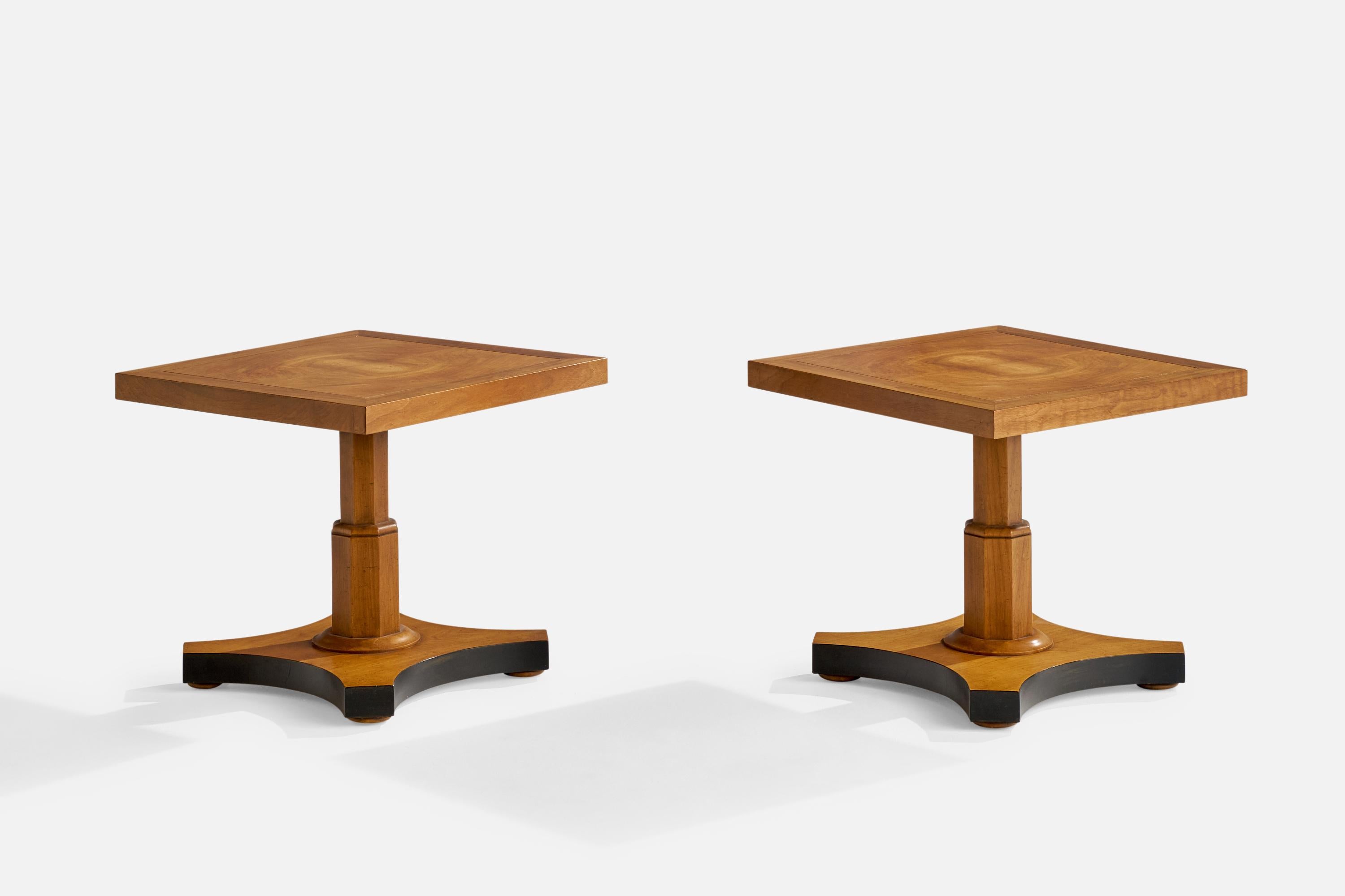 A pair of semi black-painted walnut side tables designed and produced by Baker Furniture, USA, c. 1940s.