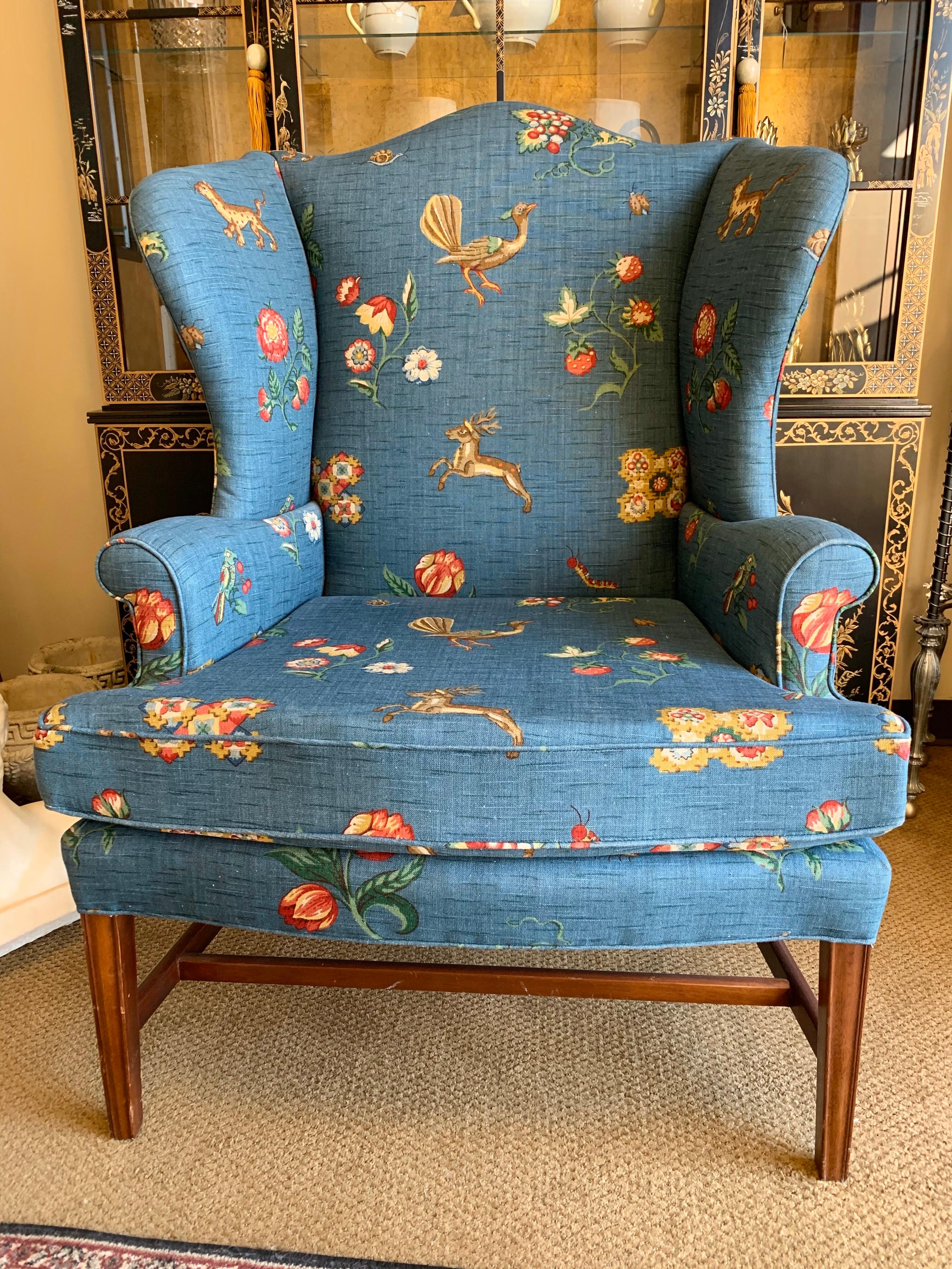 Elegant Baker Furniture large wing back arm chair with gorgeous whimsical fabric.