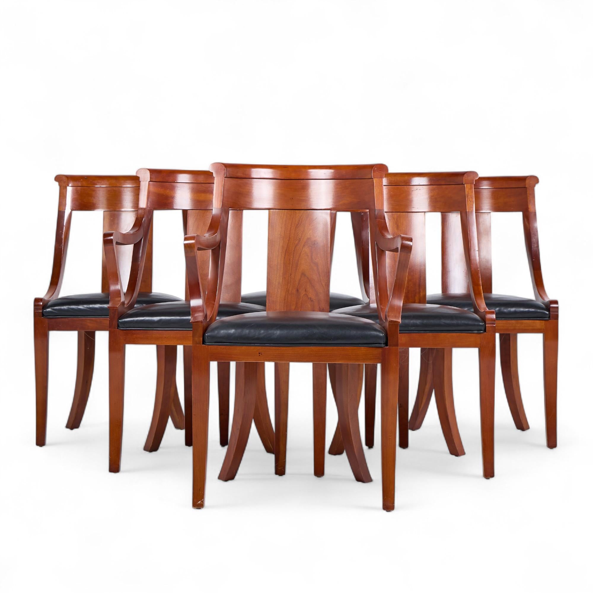Baker Furniture Solid Cherry Wood Regency Dining Chairs - Set of 6

Each armless chair measures: 20.5 wide x 23 deep x 35 high, with a seat height of 19 inches
Each captains chair measures: 23.25 wide x 23 deep x 35.5 high, with a seat height of 19