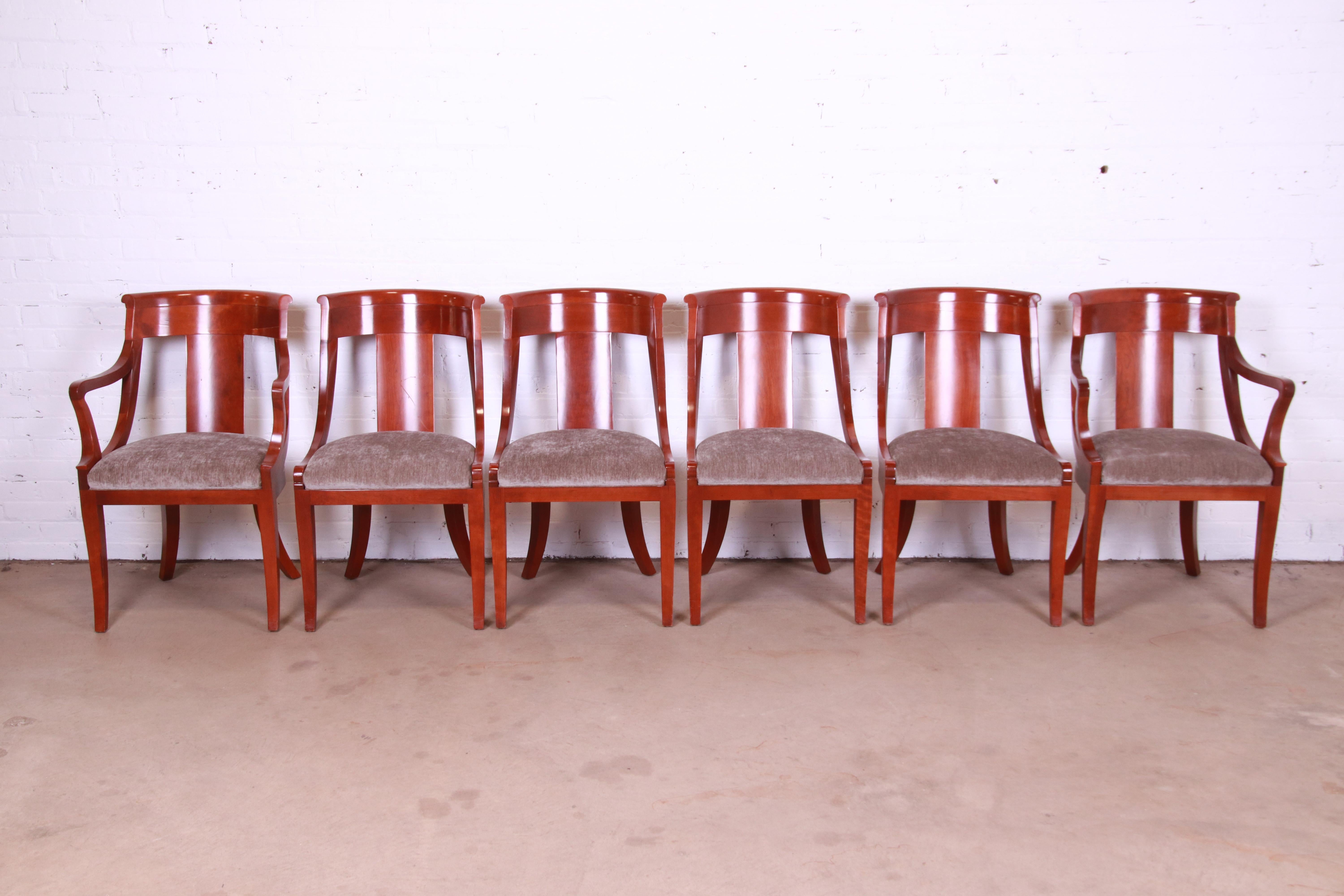 An outstanding set of six Regency style dining chairs.

By Baker Furniture

USA, Circa 1980s

Solid cherry wood frames, with gray velvet upholstered seats.

Measures:
Side chairs - 20.5