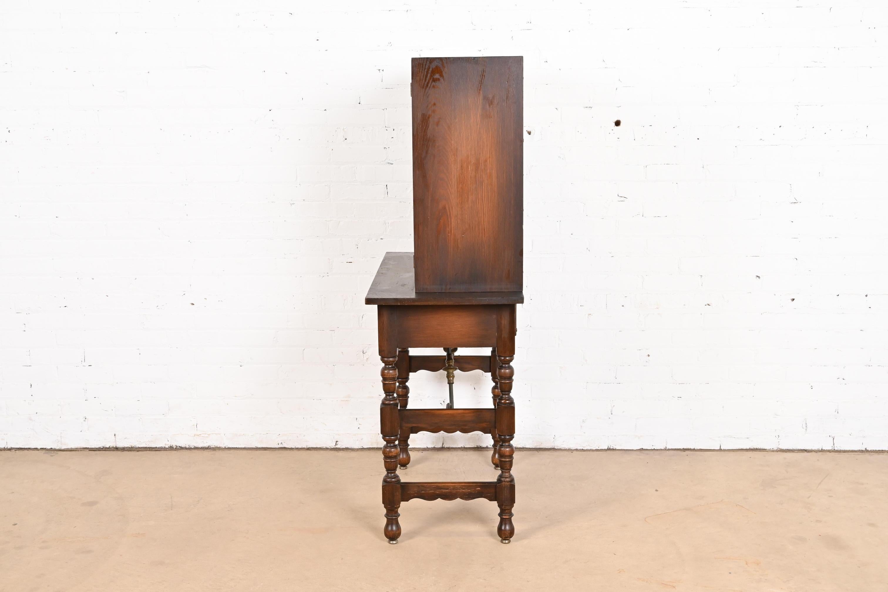 Baker Furniture Spanish Colonial Carved Oak Leather Front Bookcase or Cabinet For Sale 5