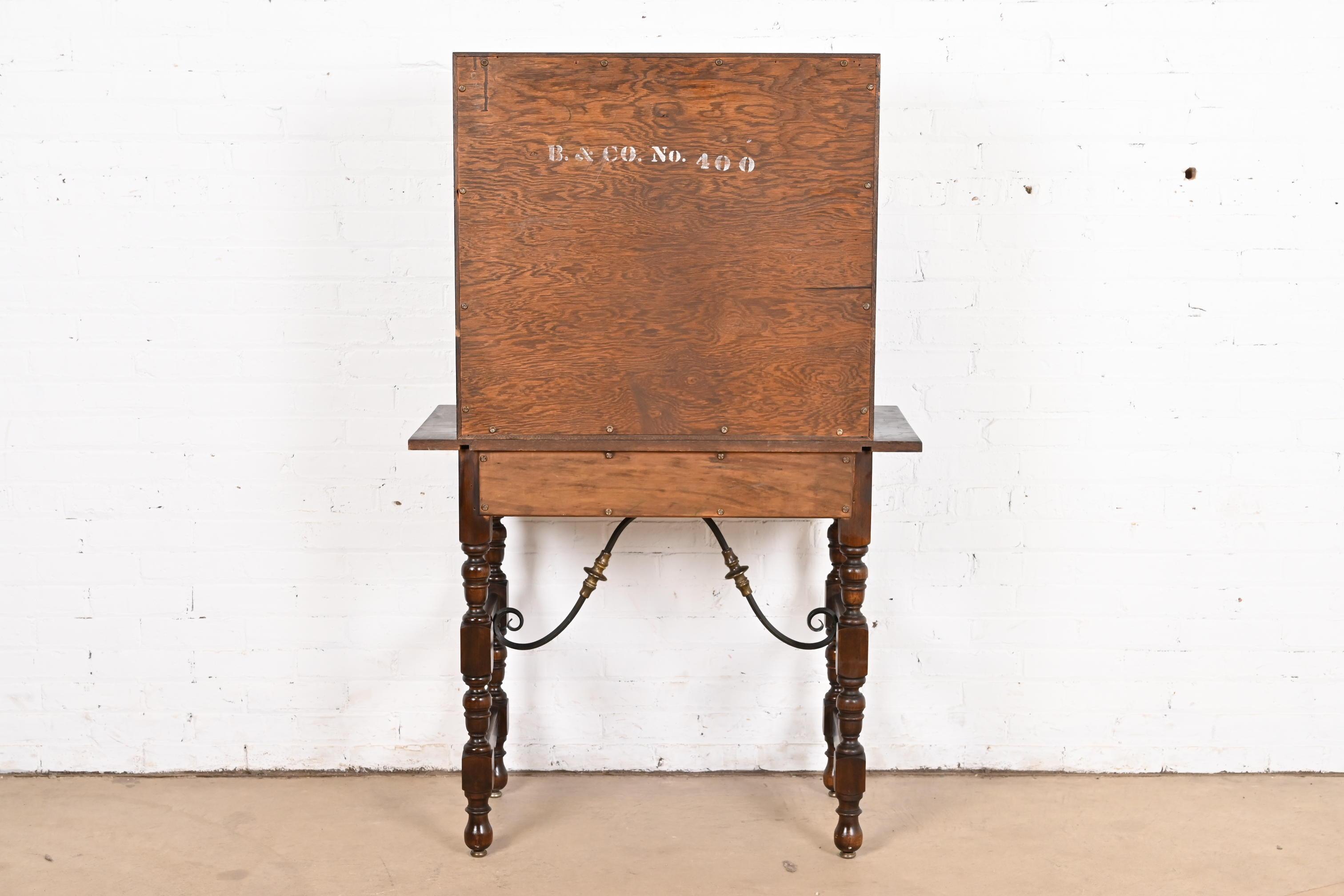 Baker Furniture Spanish Colonial Carved Oak Leather Front Bookcase or Cabinet For Sale 6