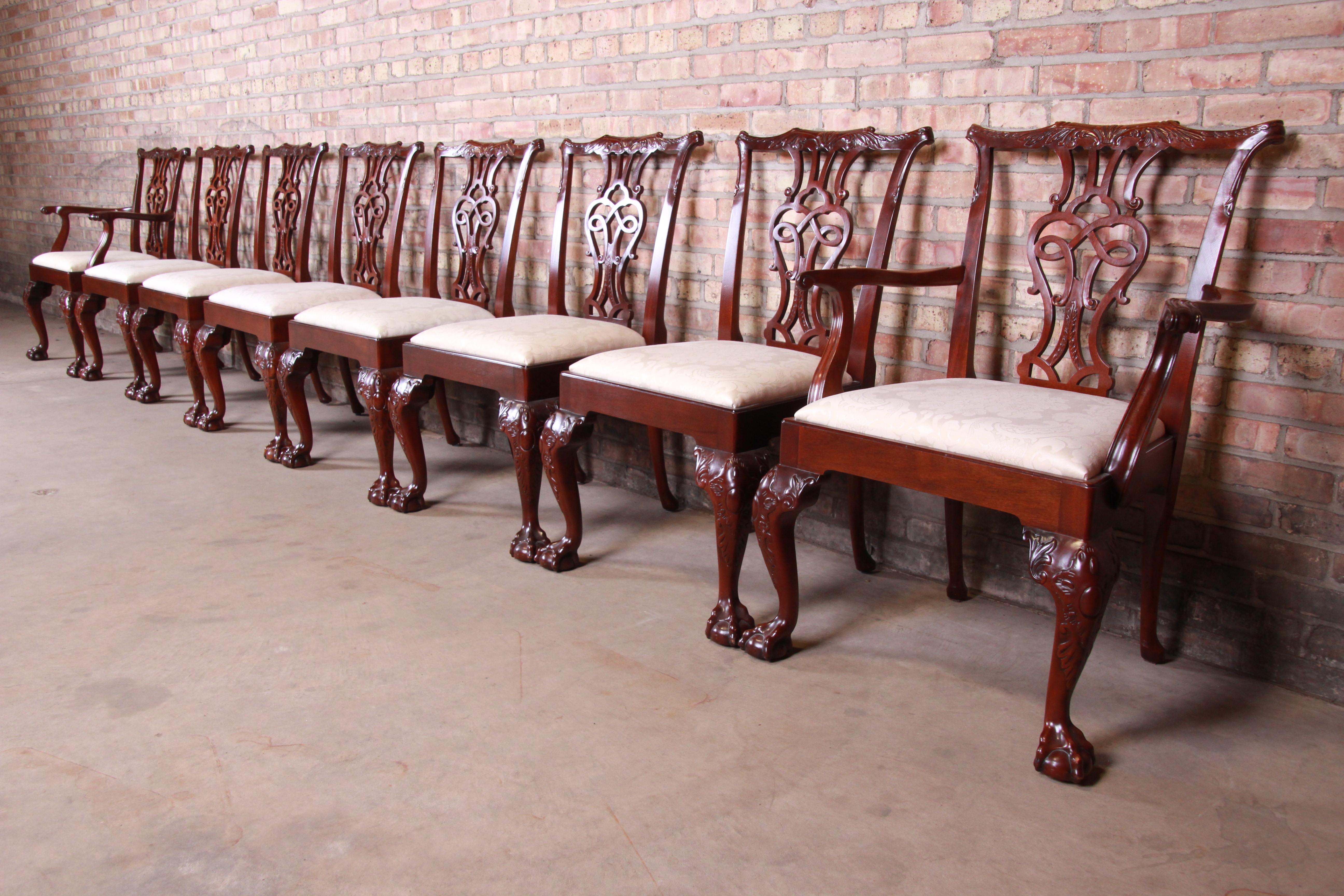A rare and exceptional set of eight fine Chippendale carved mahogany dining chairs from the exclusive Stately Homes Collection by Baker Furniture.

The set includes two open armchairs and six side chairs. The chairs feature shaped back supports