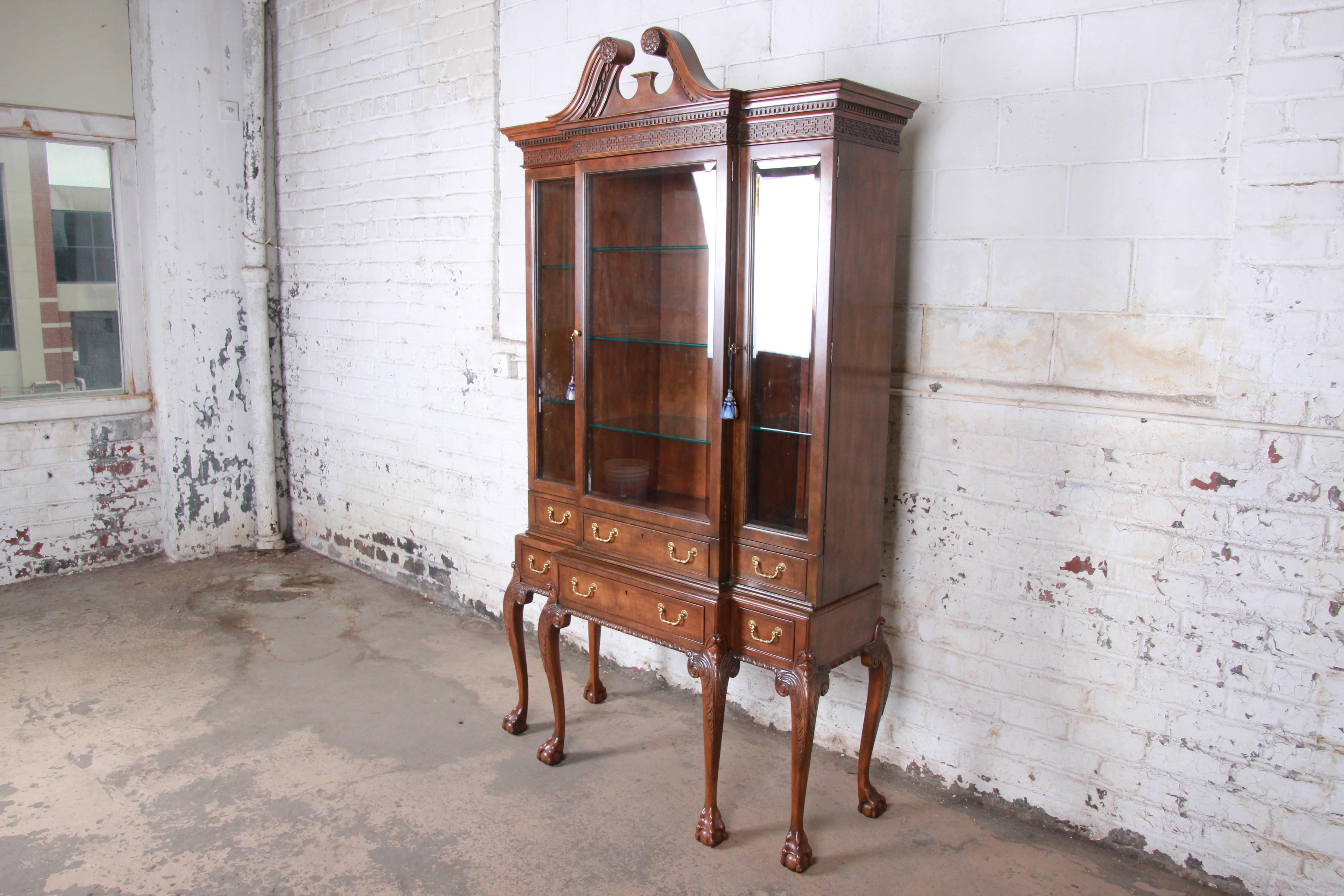An exceptional Chippendale carved walnut breakfront china display cabinet or bookcase

By Baker Furniture 