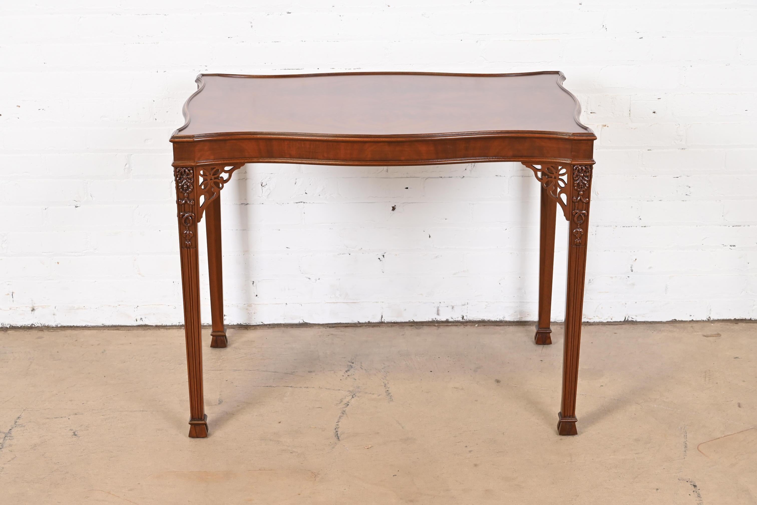 An exceptional Chippendale style carved mahogany occasional side table or tea table

By Baker Furniture, 