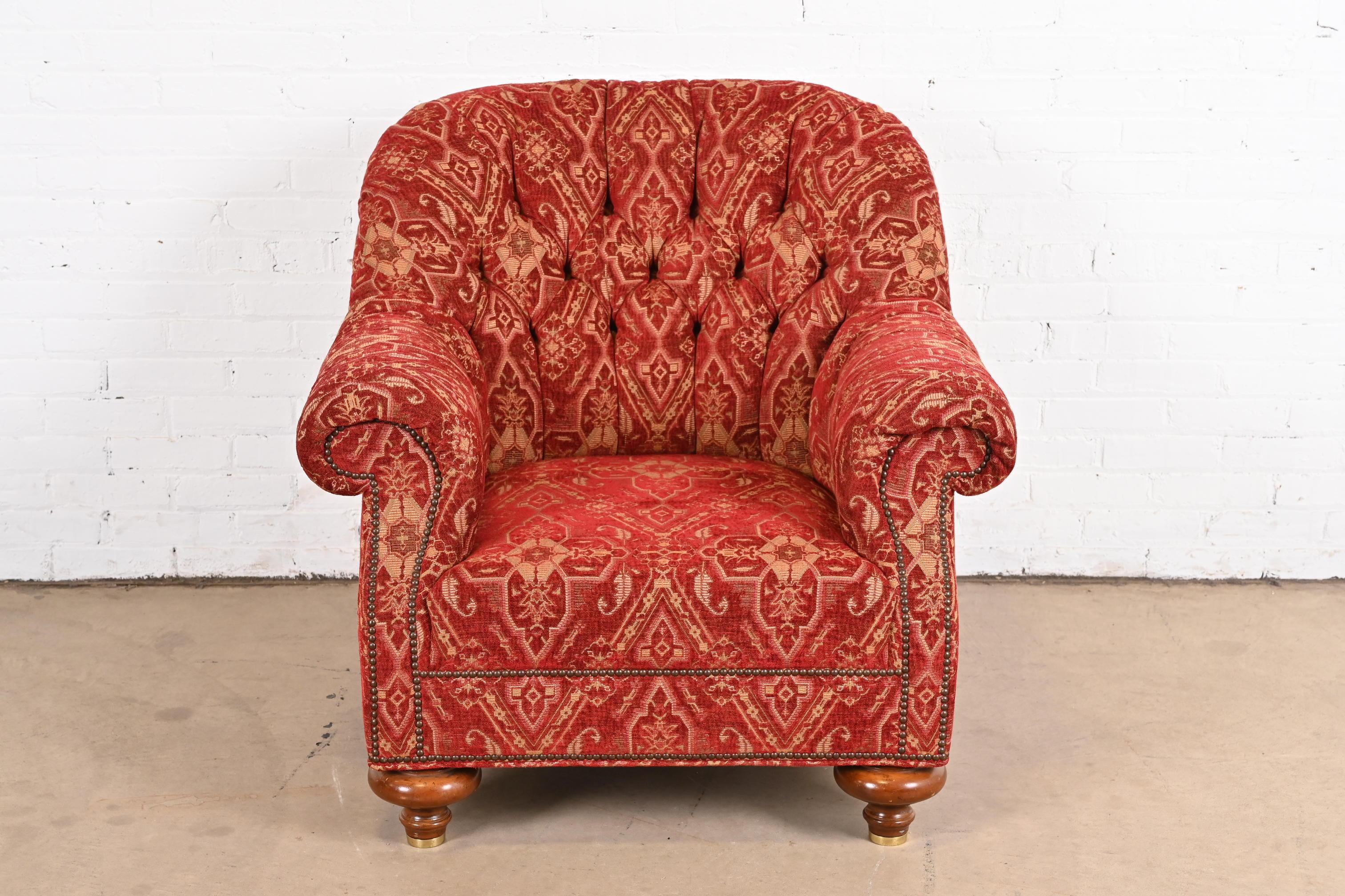 An outstanding late Victorian custom upholstered deep tufted club chair or tub chair with scrolled arms on turned bun feet

From the exclusive 