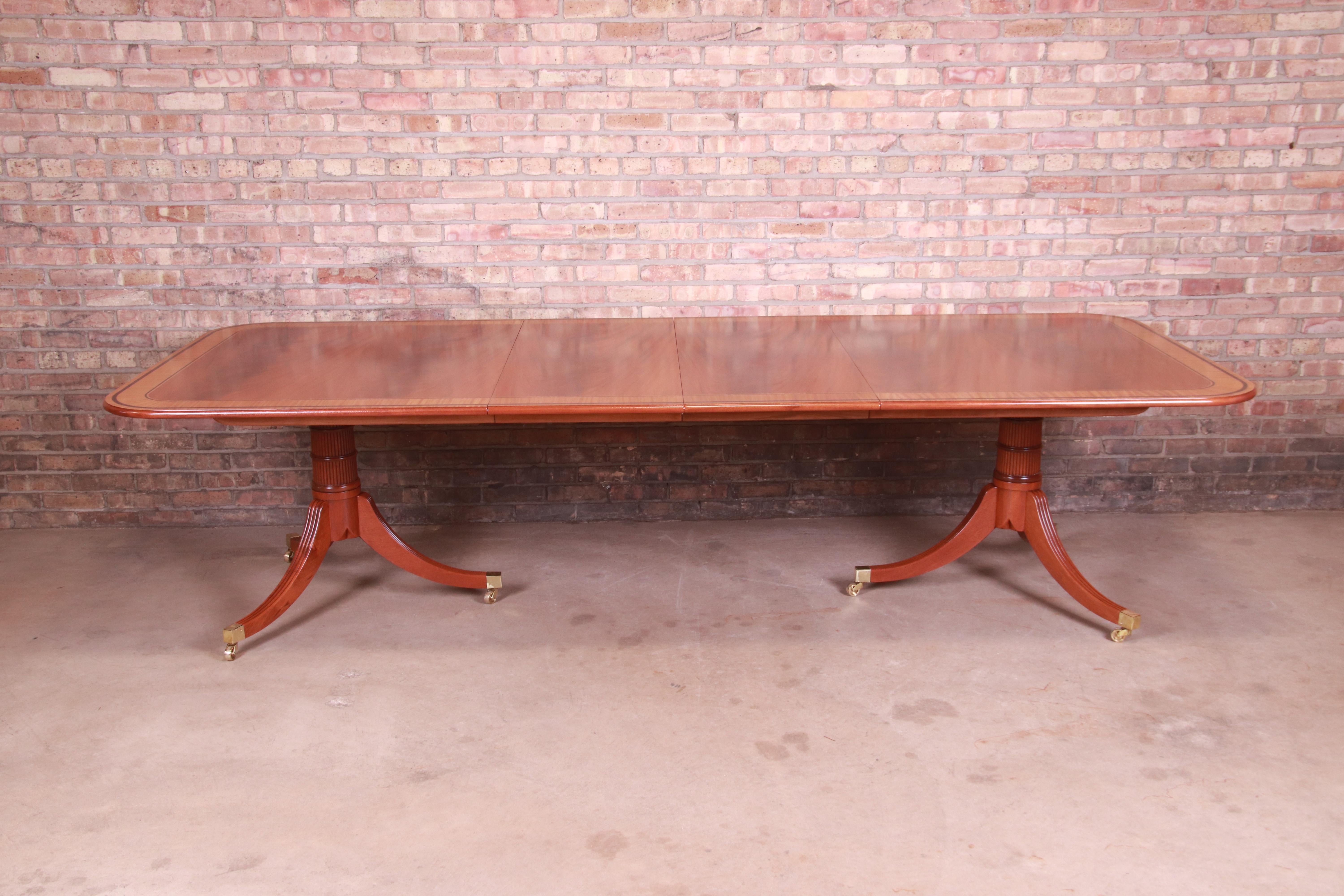 A rare and outstanding Regency double pedestal extension dining table

By Baker Furniture, 