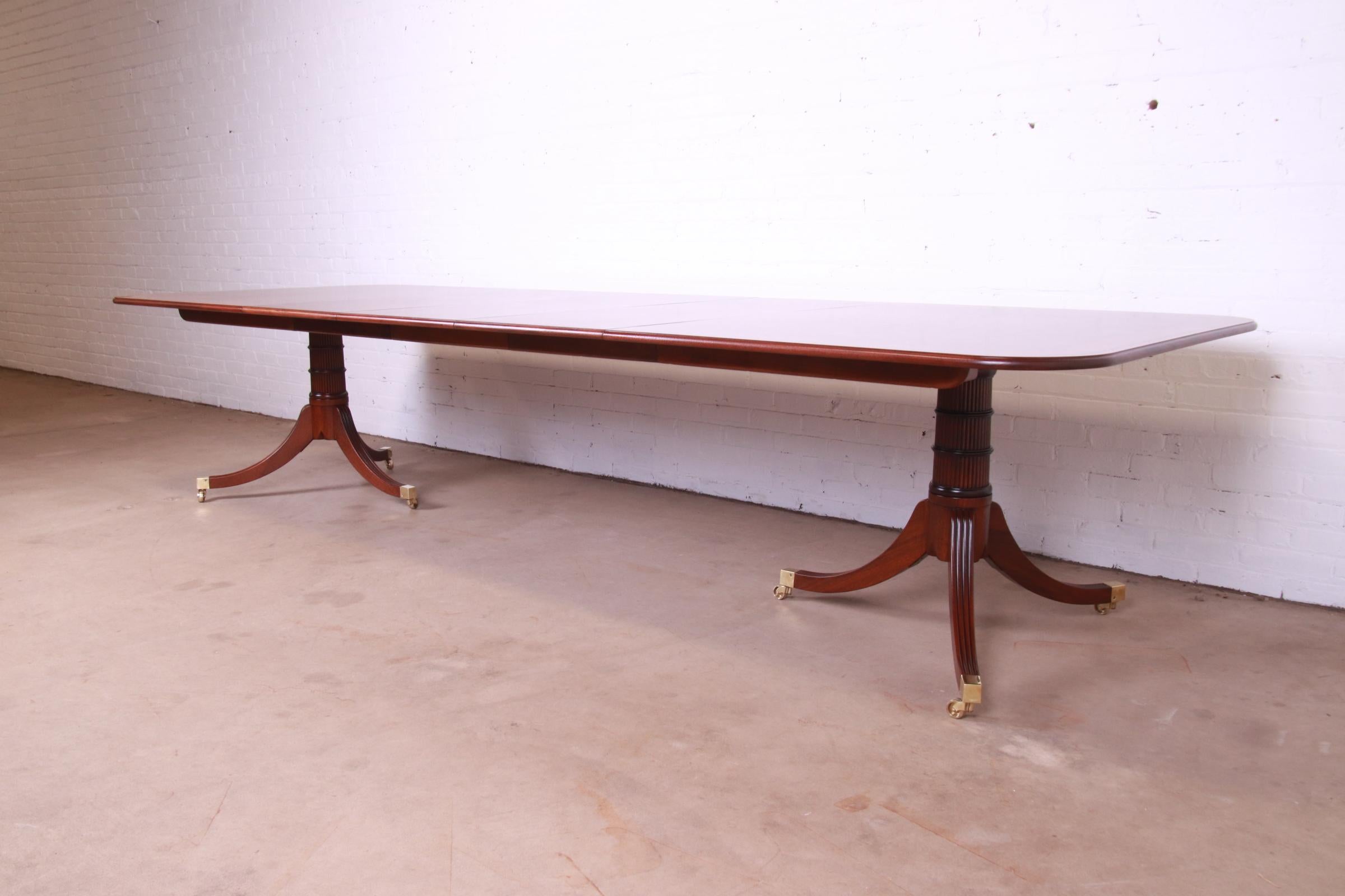 A rare and outstanding Regency double pedestal extension dining table

By Baker Furniture, 