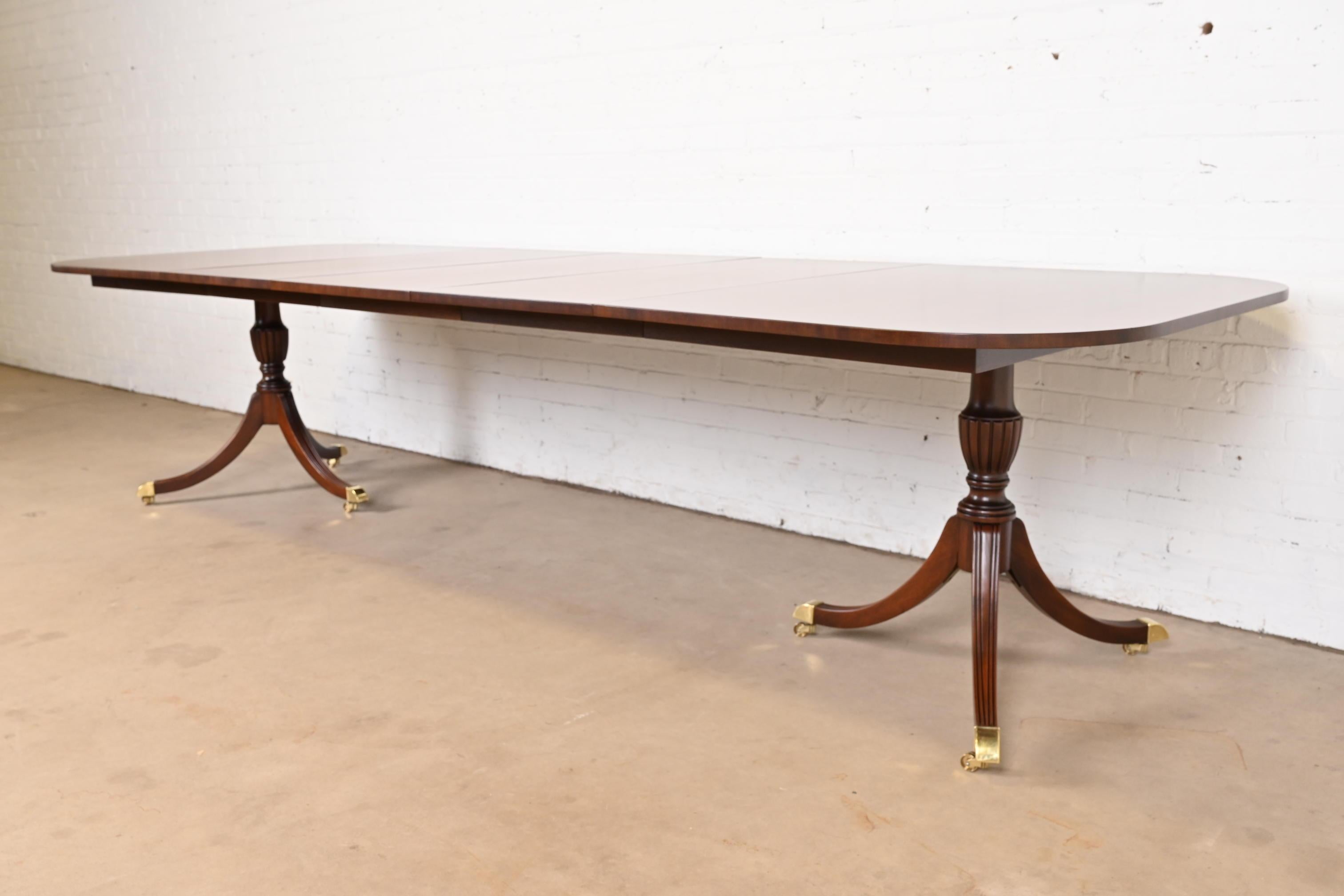 20th Century Baker Furniture Style Georgian Banded Mahogany Double Pedestal Dining Table For Sale