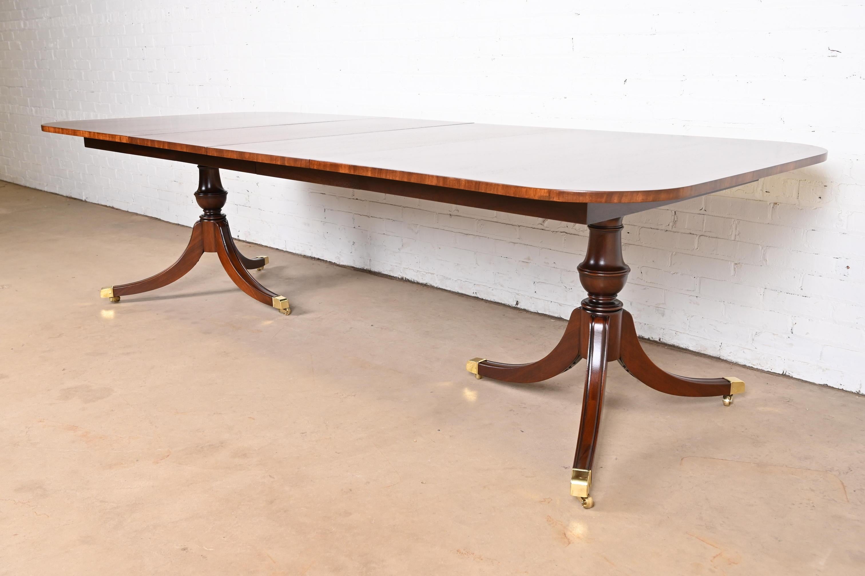 Late 20th Century Baker Furniture Style Georgian Banded Mahogany Double Pedestal Dining Table
