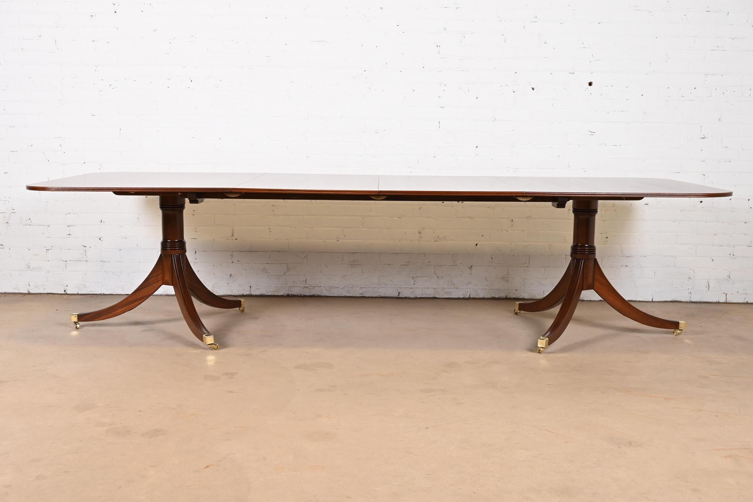 20th Century Baker Furniture Style Georgian Banded Mahogany Double Pedestal Dining Table
