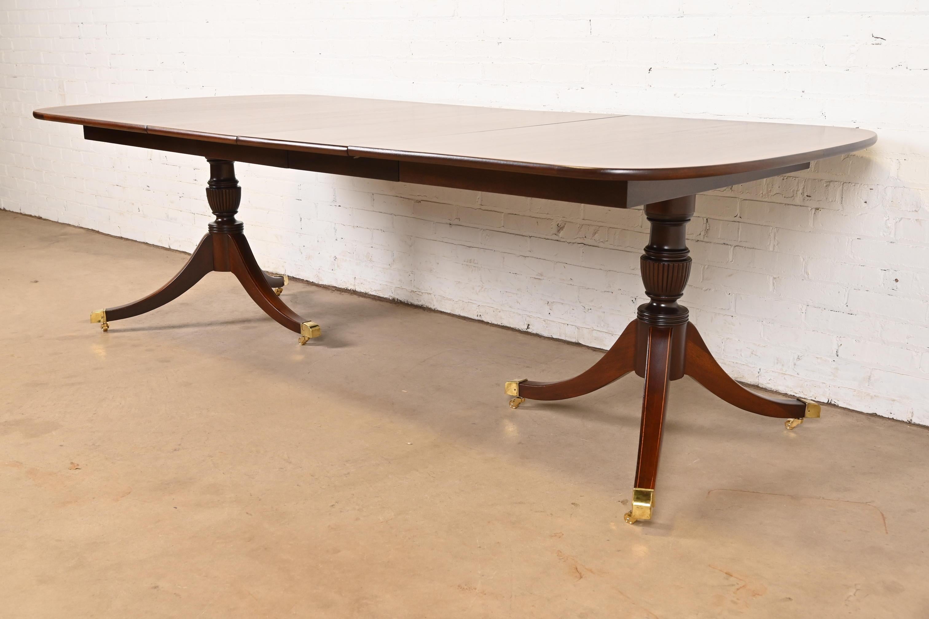 Late 20th Century Baker Furniture Style Georgian Banded Mahogany Pedestal Dining Table, Refinished For Sale