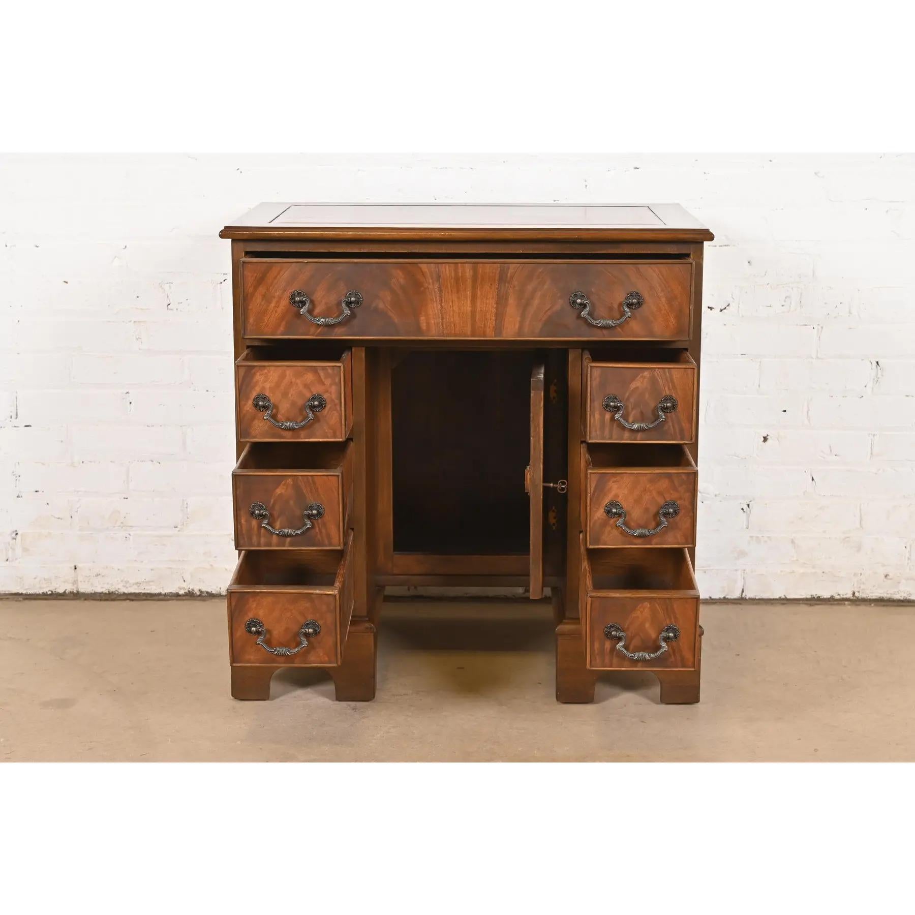 Brass Baker Furniture Style Georgian Flame Mahogany Writing Desk, Circa 1940s For Sale