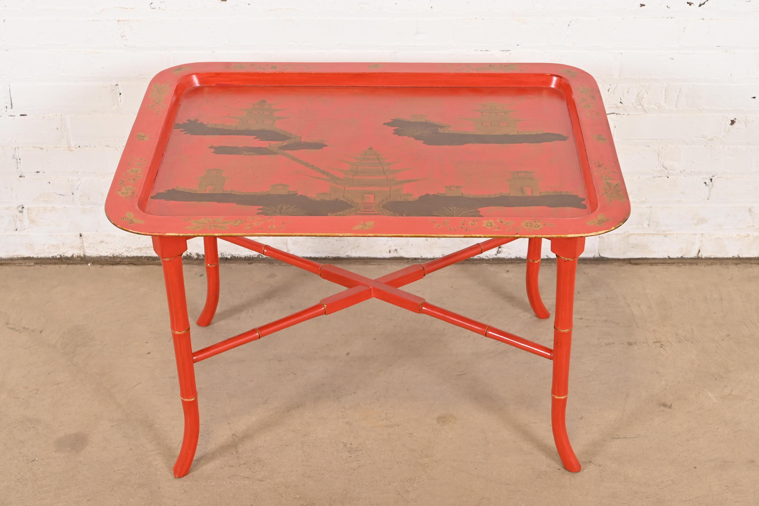 A gorgeous mid-century Hollywood Regency Chinoiserie coffee or cocktail table

In the manner of Baker Furniture

USA, Circa 1960s

Red lacquered finish, with hand-painted Chinese scenes, and faux bamboo x-base.

Measures: 30.75