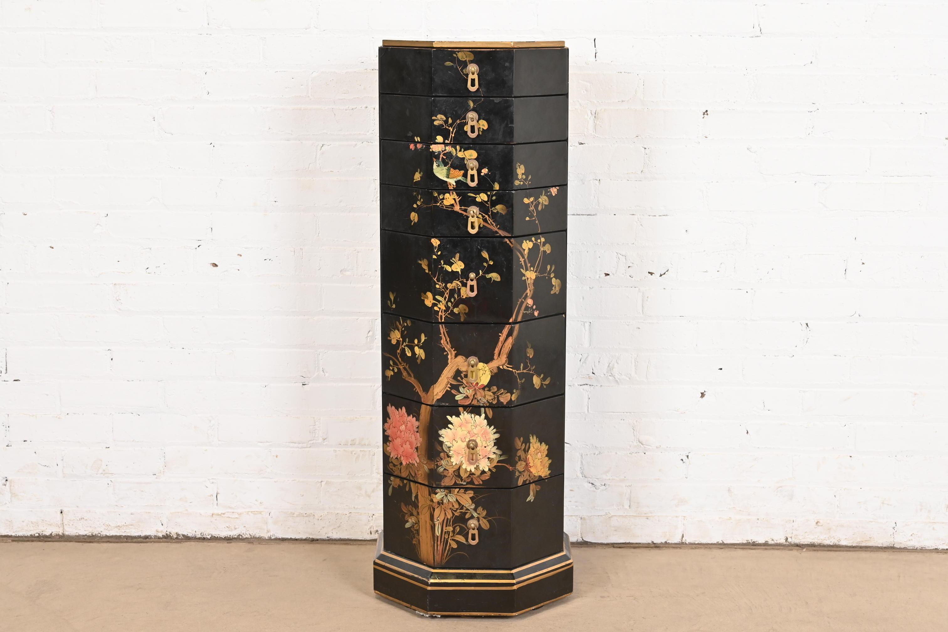 A gorgeous mid-century Hollywood Regency Chinoiserie eight-drawer lingerie chest of drawers

In the manner of Baker Furniture

USA, Circa 1970s

Black lacquered and gold gilt wood, with hand-painted Asian nature scenes, and original brass