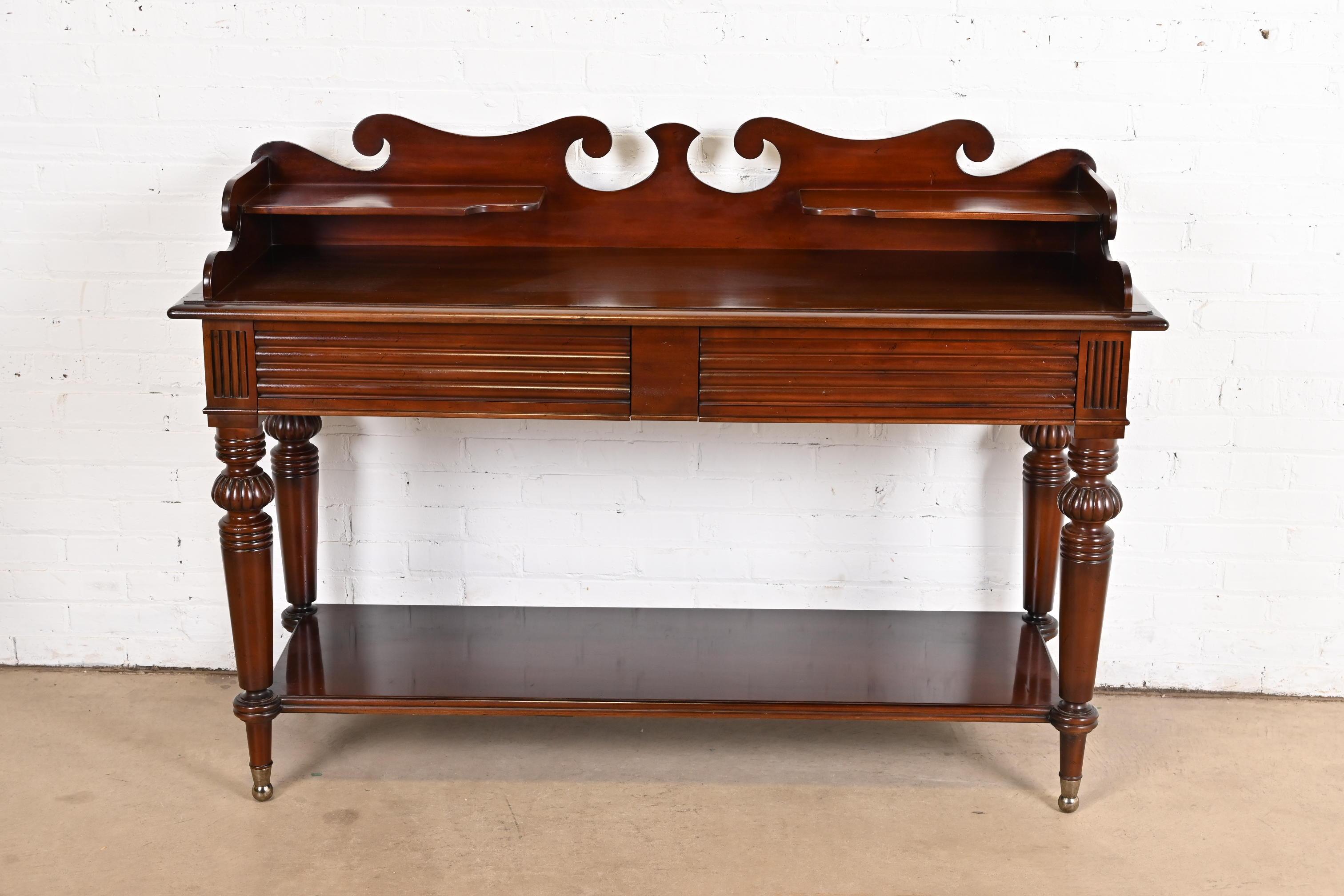 An exceptional Victorian or American Colonial style carved mahogany sideboard, buffet server, or console table

By Baker Furniture, 