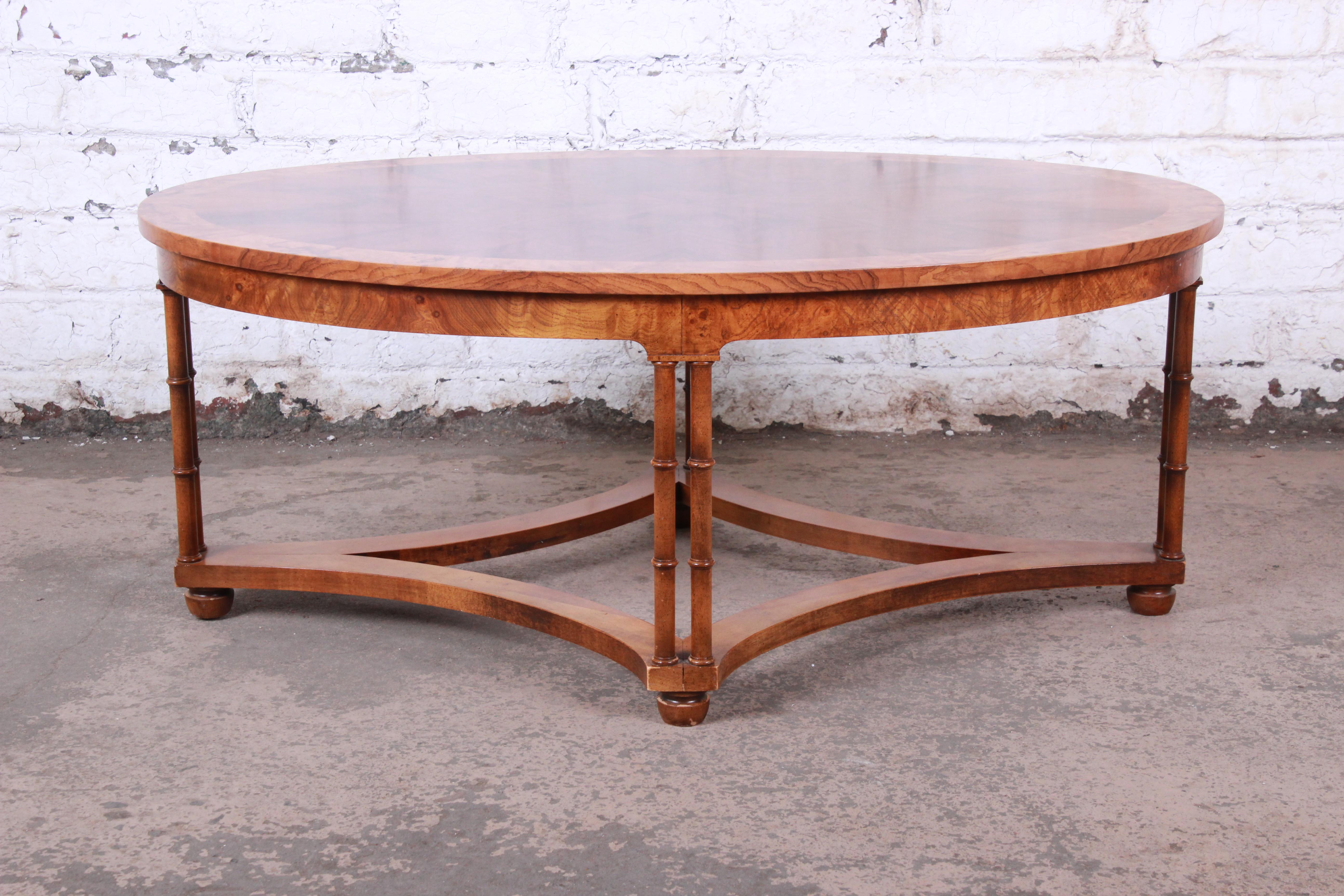 An exceptional midcentury Hollywood Regency chinoiserie coffee or cocktail table

By Baker Furniture

USA, circa 1960s

Bookmatched walnut, olive ash burl and faux bamboo

Measures: 42
