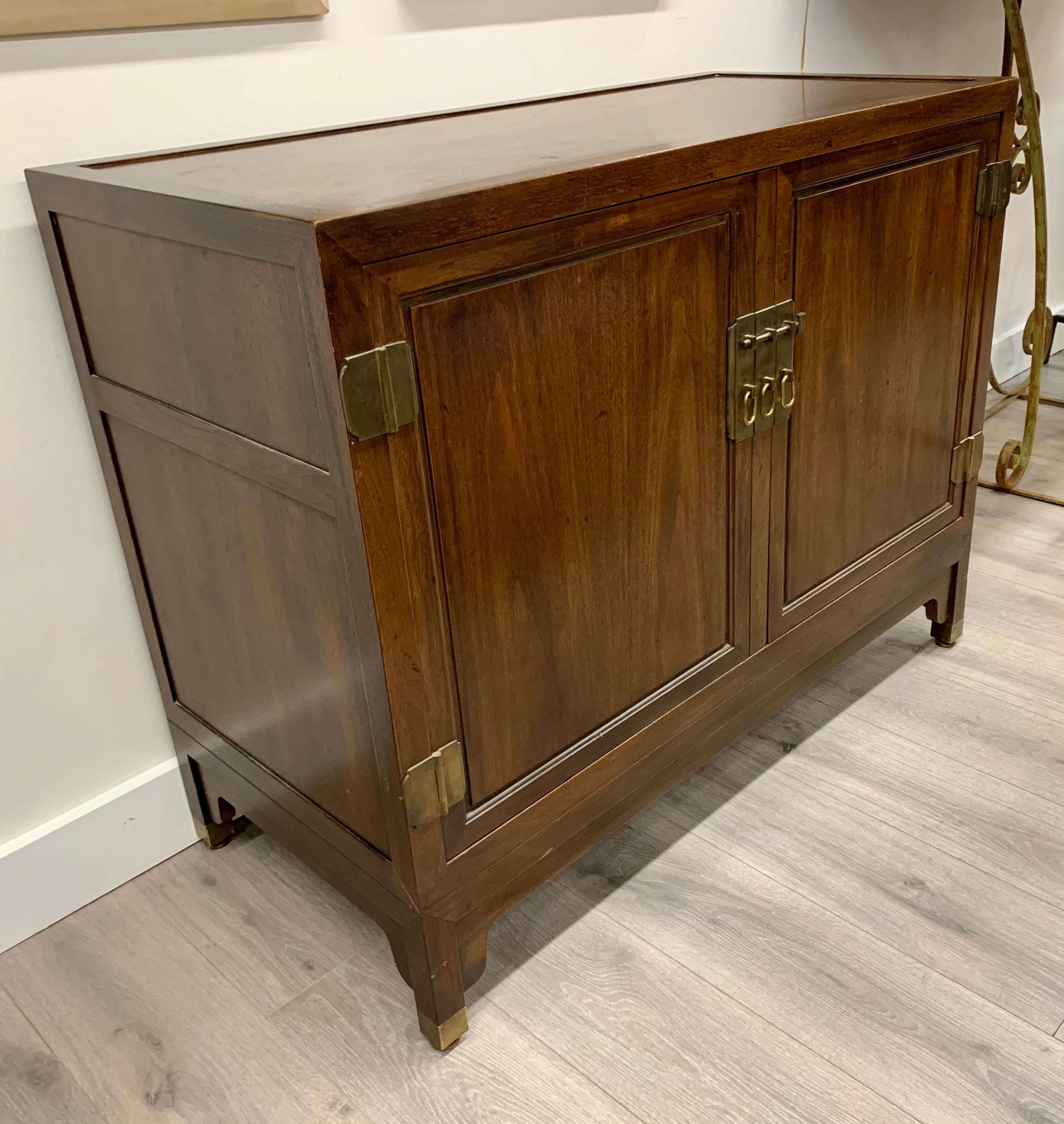 Baker Furniture walnut sideboard cabinet with great scale and better lines.
Baker Furniture is one of the great furniture makers in the world. Multi-purpose
utilization - the opportunities are many. Now, more than ever, home is where the