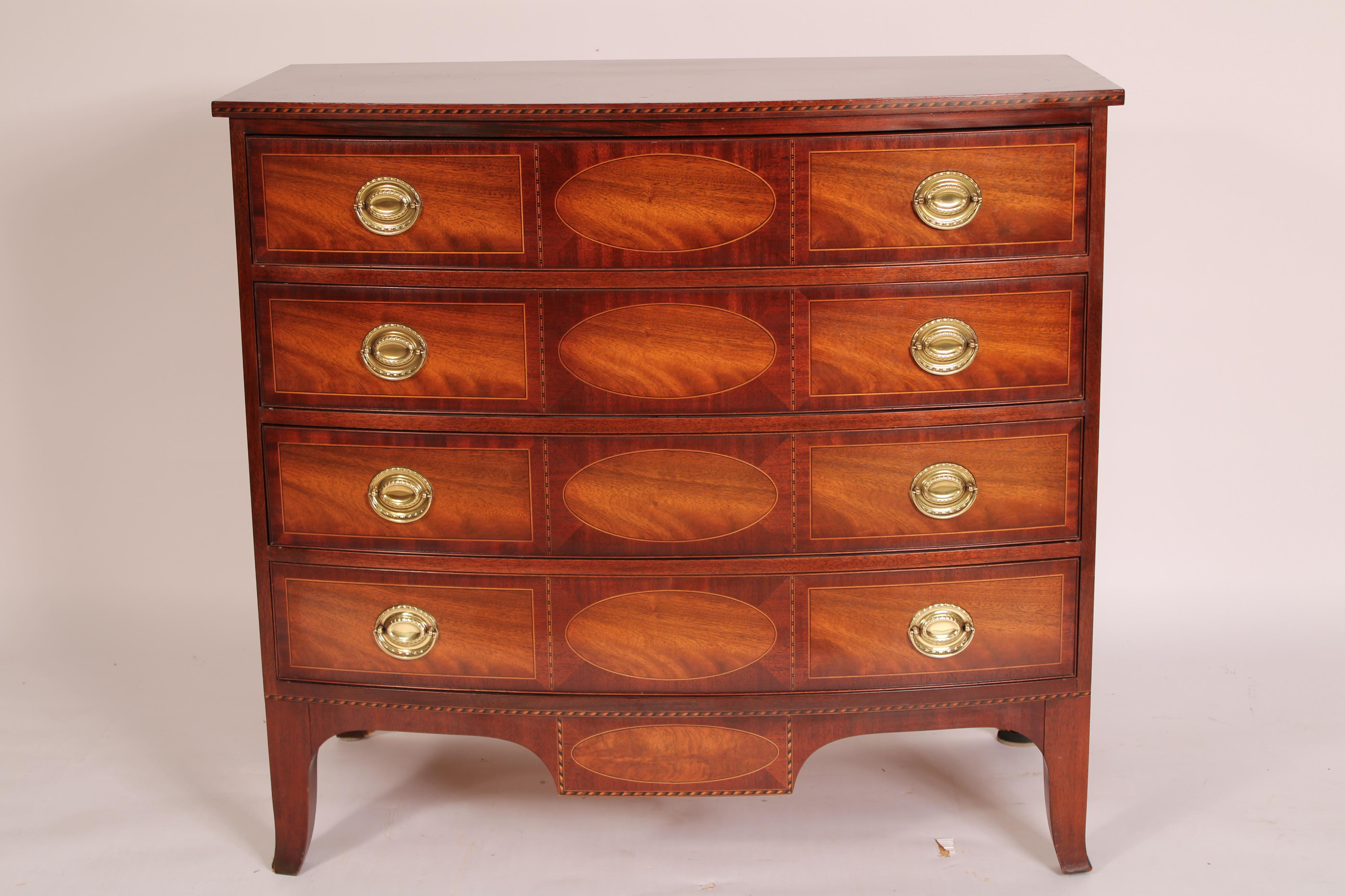 American Federal style bow front mahogany chest of drawers with brass hardware, early 21st century. Made by Baker Furniture Company, part of the Historic Charleston Collection. With a D shaped top with inlay on front and side edges, 4 equal size