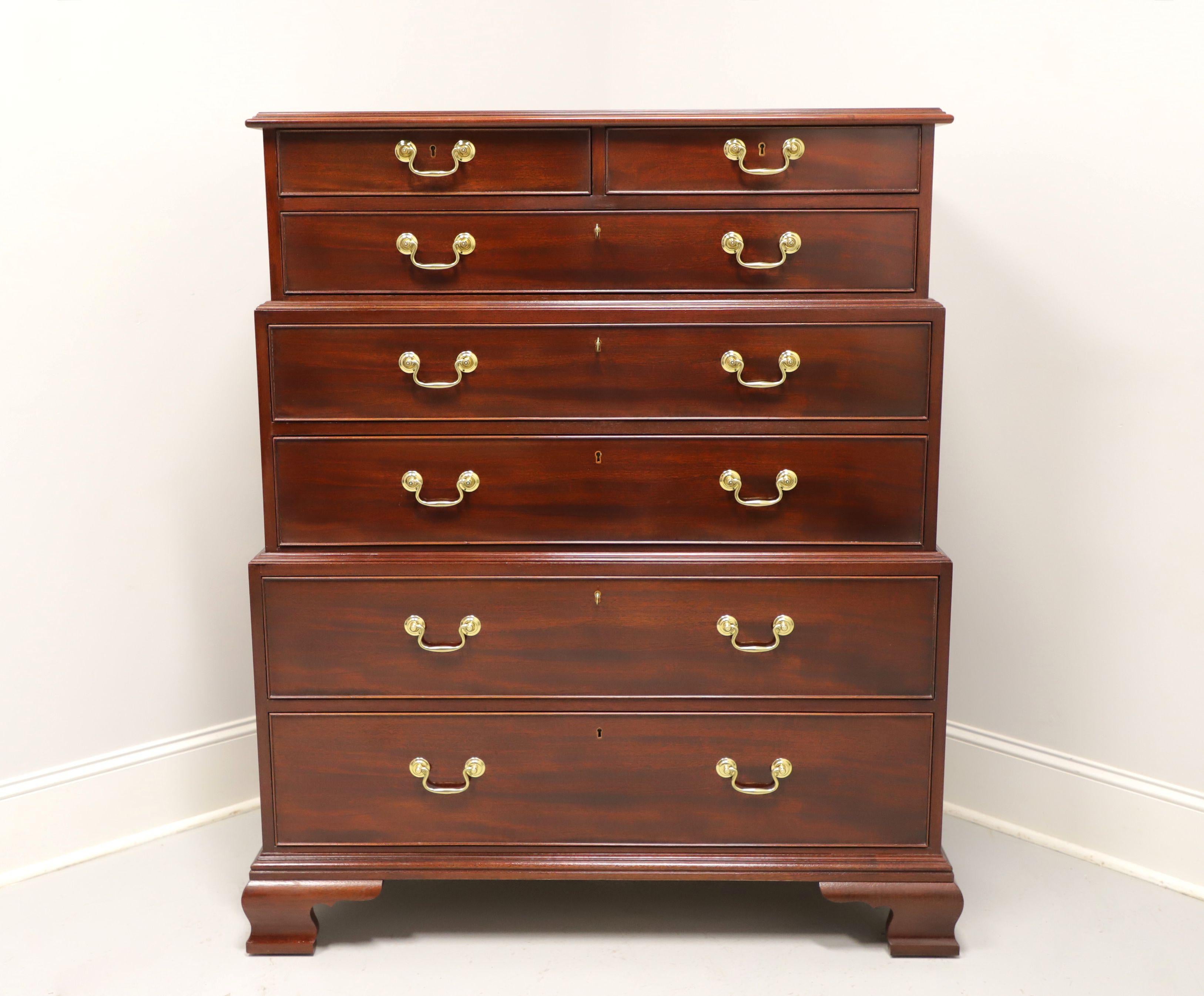 A reproduction of an 18th century design Chippendale style three-tier chest on chest by Baker Furniture, from their Historic Charleston Collection. Solid mahogany finest quality construction, brass hardware, triple stacking chests with brass handles