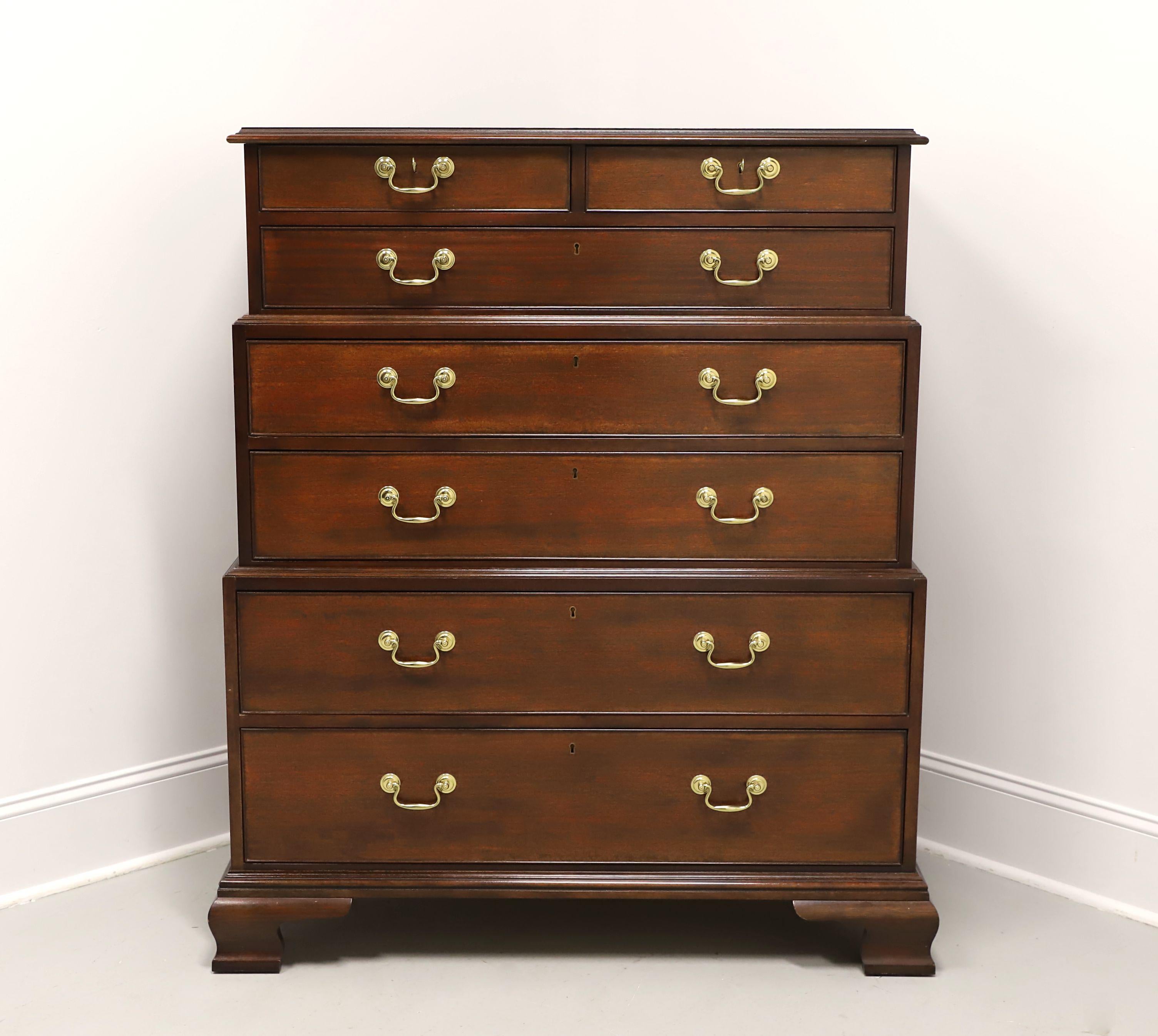 A reproduction of an 18th Century design Chippendale style three-tier chest on chest by Baker Furniture, from their Historic Charleston Collection. Finest quality solid mahogany construction, brass hardware, ogee edge to the top, triple stacking