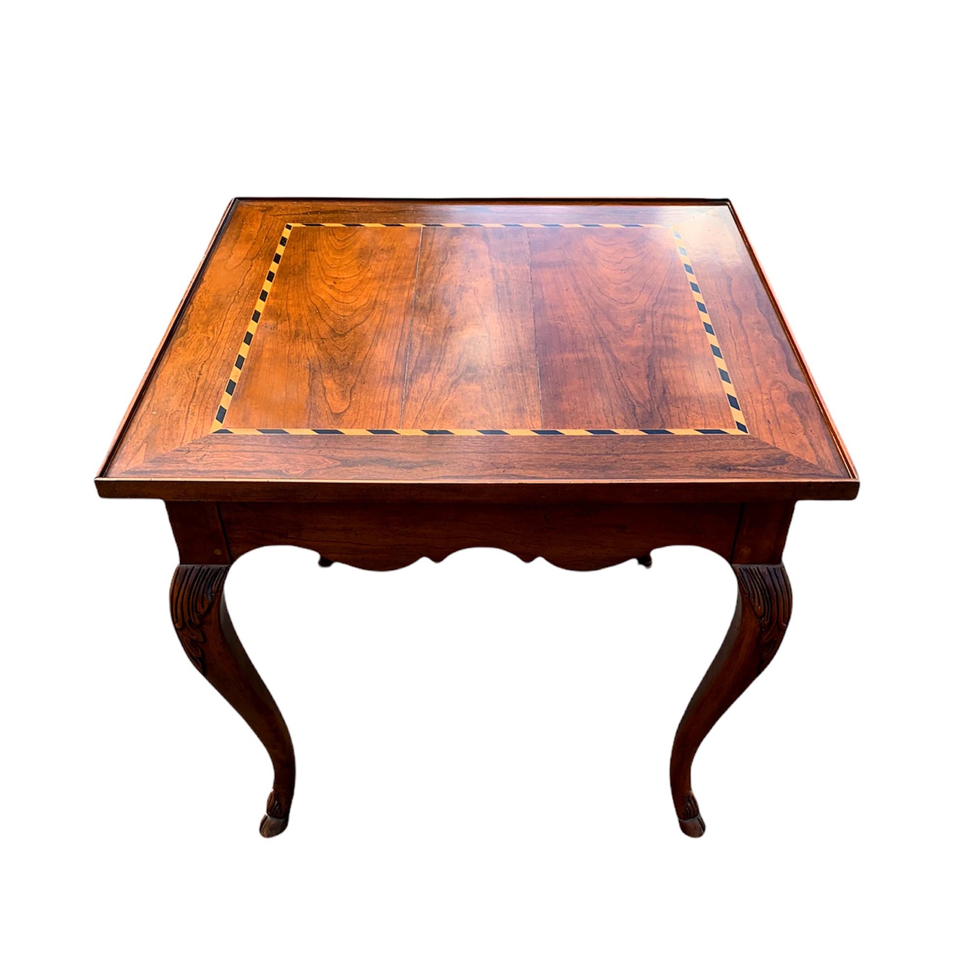 Vintage cabriole leg side table by Baker Furniture. Great quality craftsmanship. This table features a beautiful inlay wood top with a drawer and hooved feet. Finished on all sides so this piece can be placed anywhere in the room. This table would
