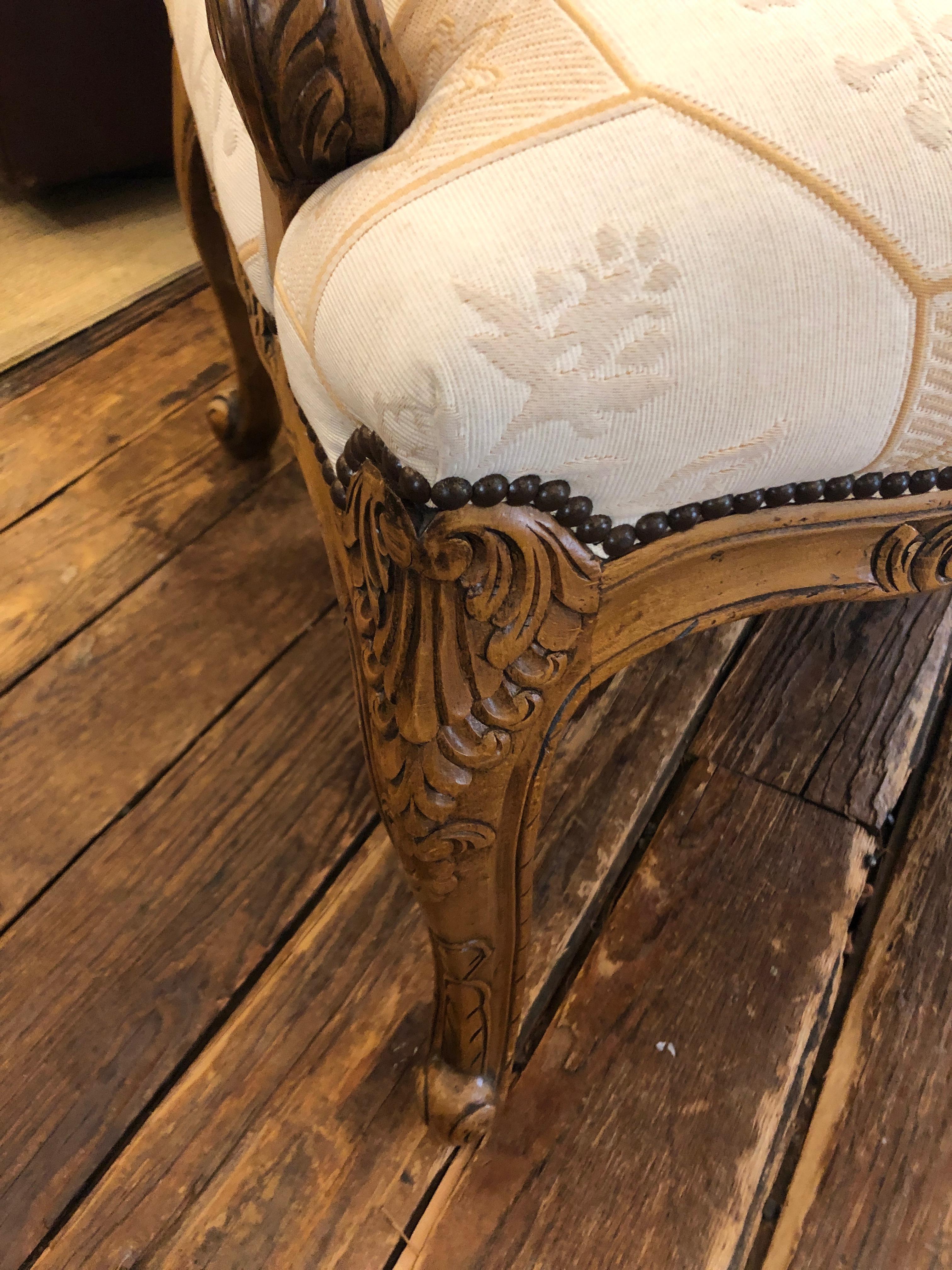 Baker Large Carved Wood and Upholstered French Style Armchair In Excellent Condition In Hopewell, NJ