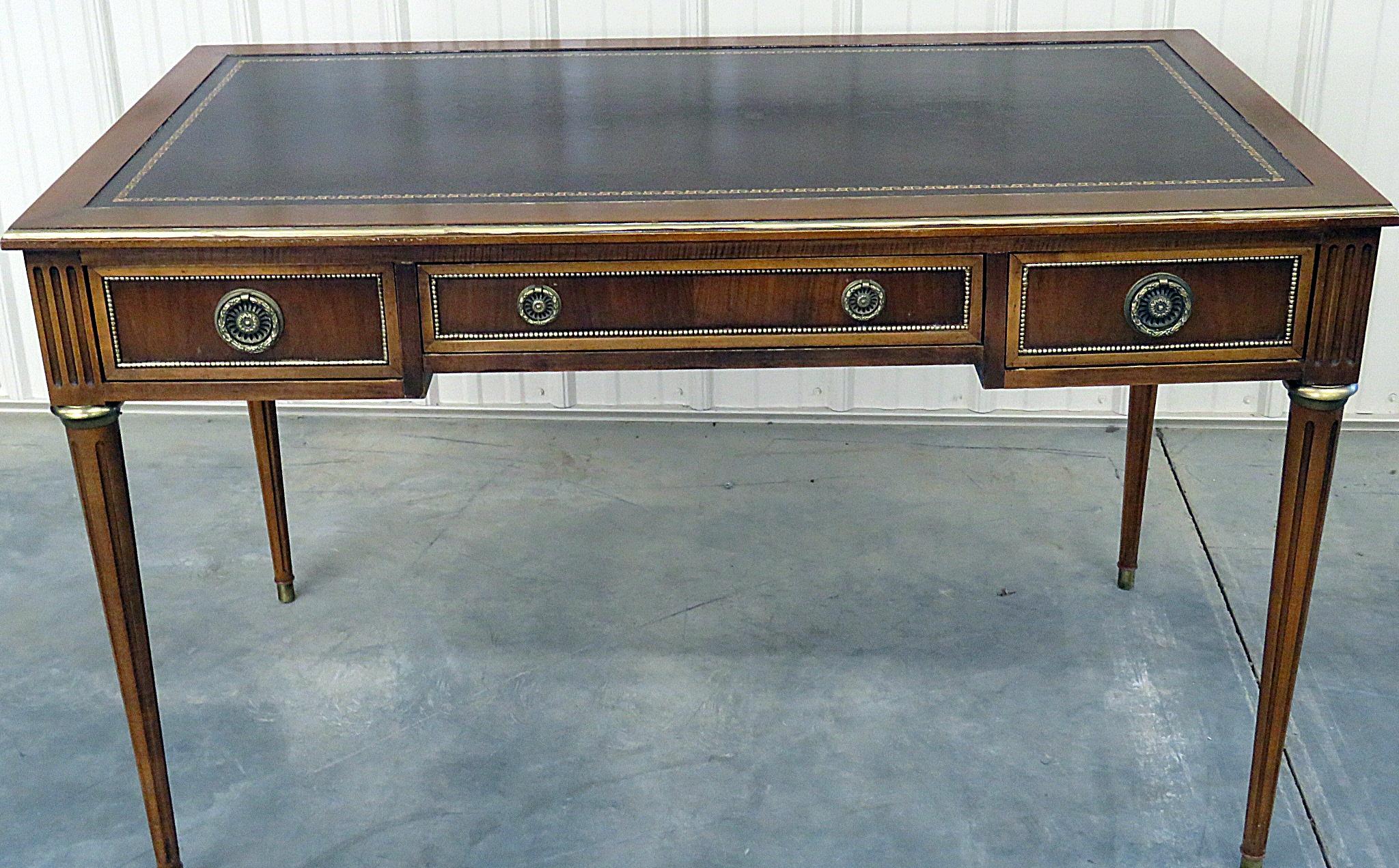 Baker Louis XVI style 3-drawer leather top desk with brass accents.