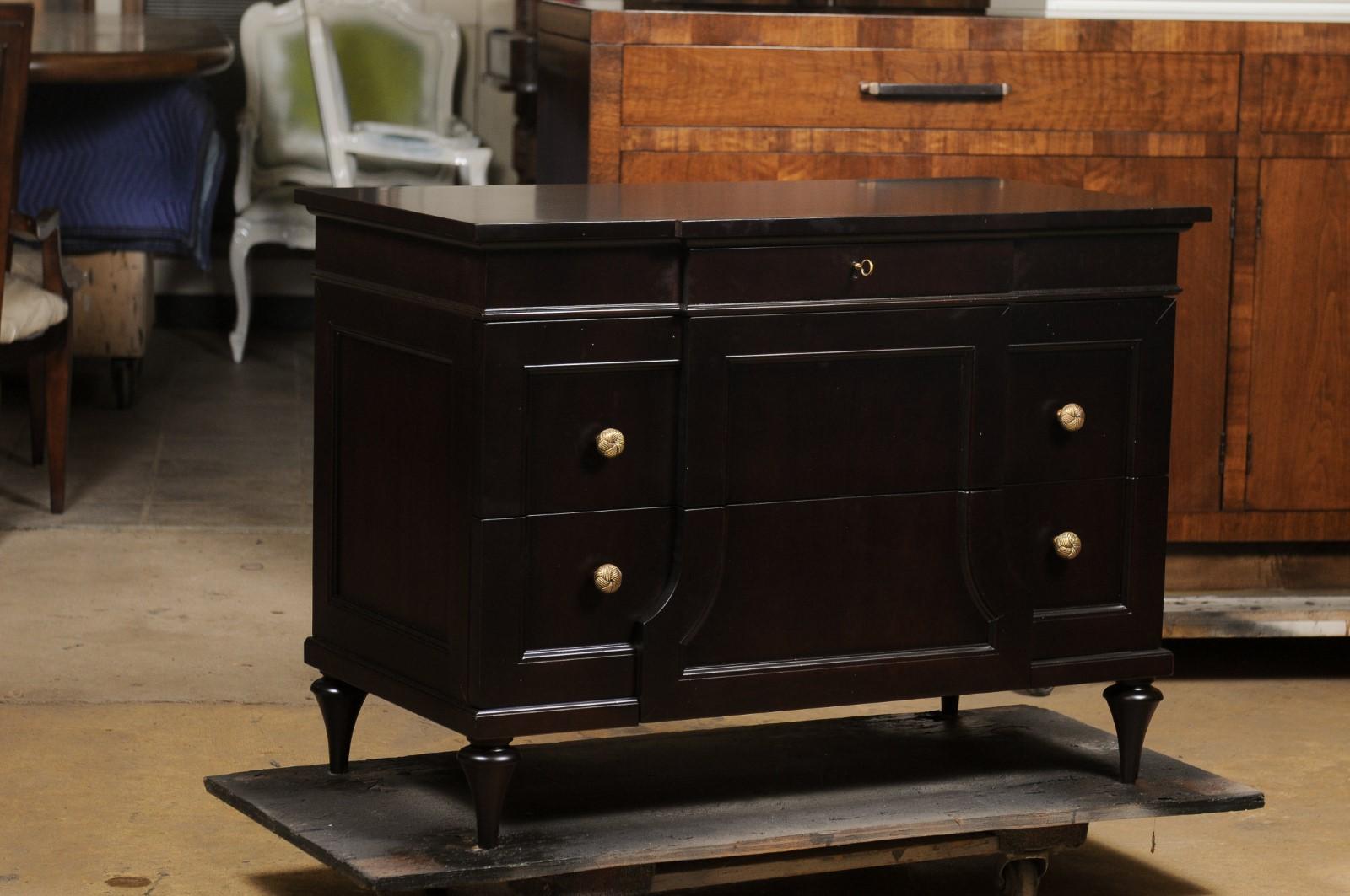 Baker mahogany chest of drawers mini credenza. Features fine veneered accents with ornate brass hardware. Two large drawers with smaller drawers at the top. Dimensions: 29 x 40 x 20 in. Ebony/black finish.
