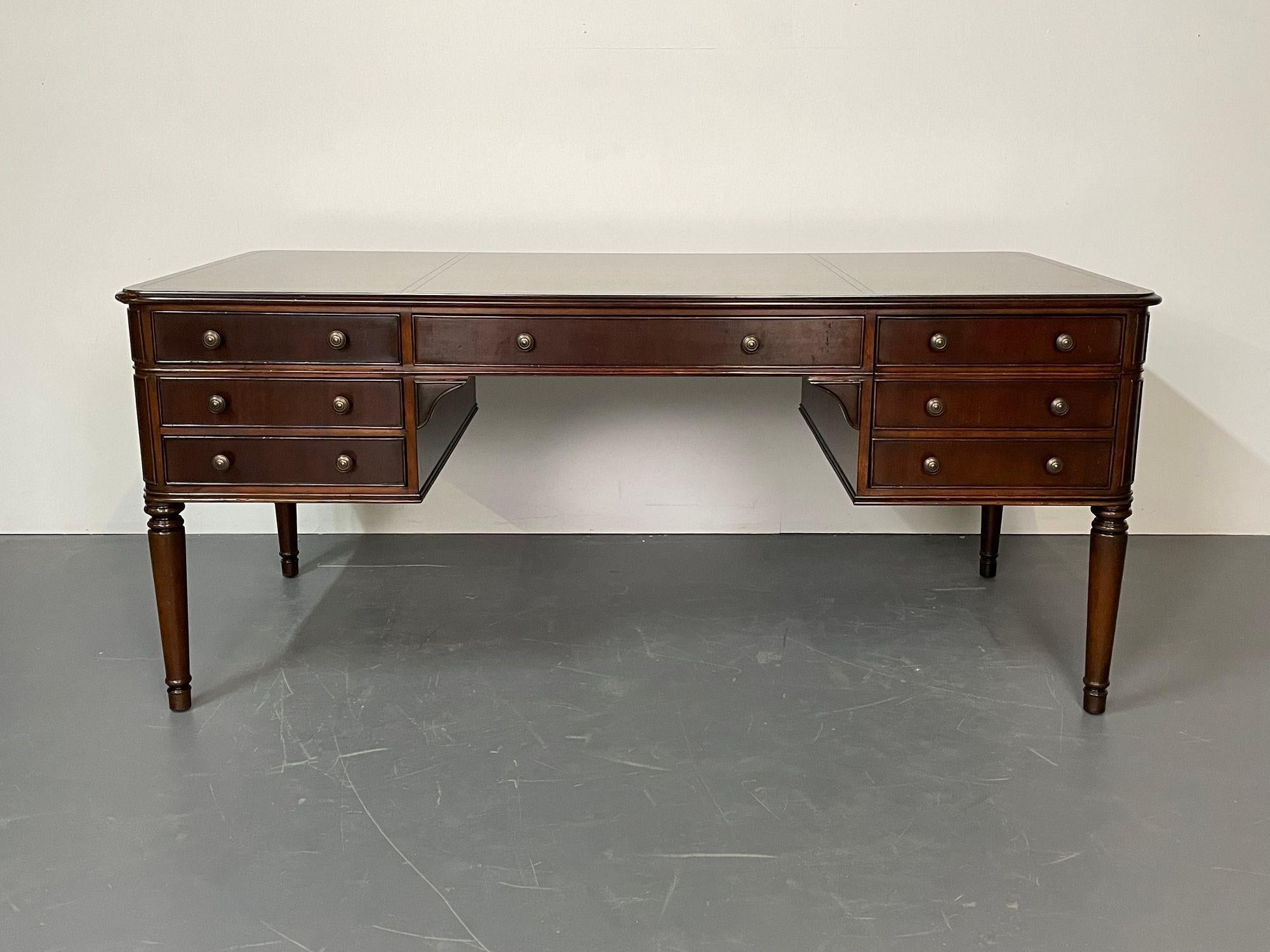 Large mahogany executive partners desk by baker, writing table in the Georgian Fashion. 
A stunning new Baker mahogany partners desk having full drawer and file sides for a compatible working partnership. A large center drawer flanked by side