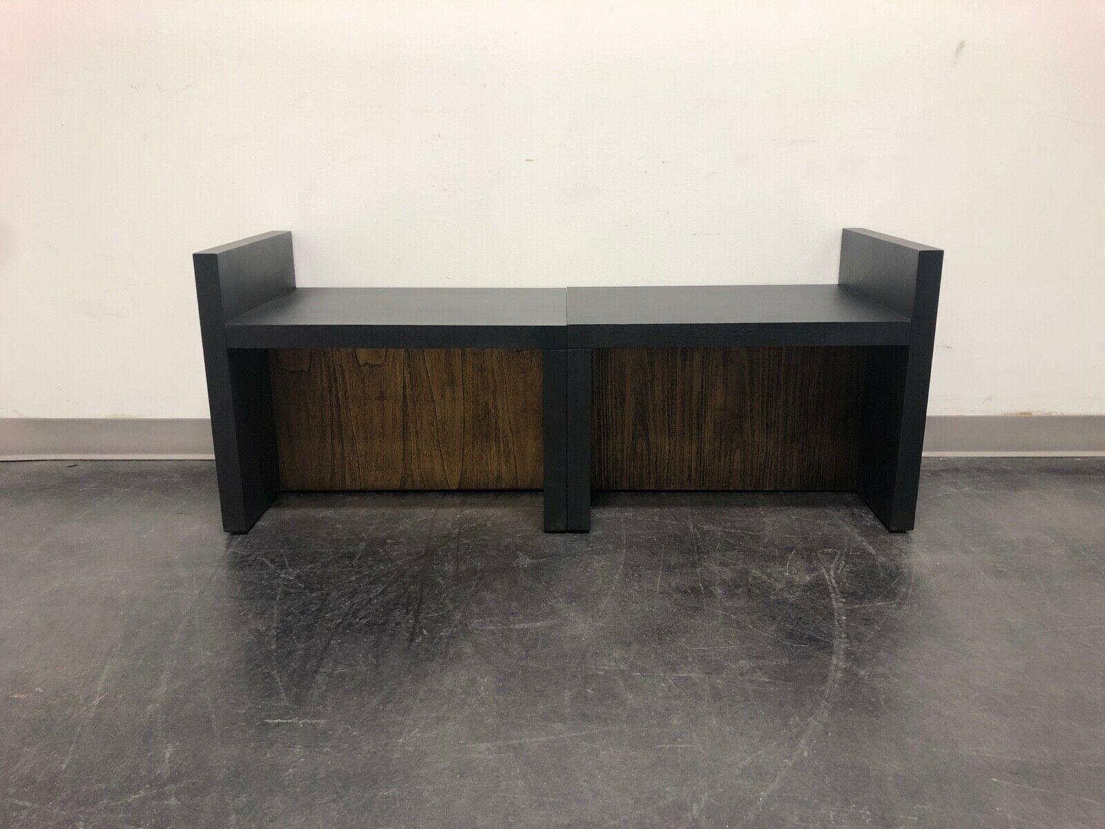 A pair of contemporary benches designed by Kara Mann for Baker Furniture Company for their Milling Road line. Black and Walnut. Simple cushions can be made to complement your existing decor. $1,795 is the price for the pair.

Baker Model #: MR