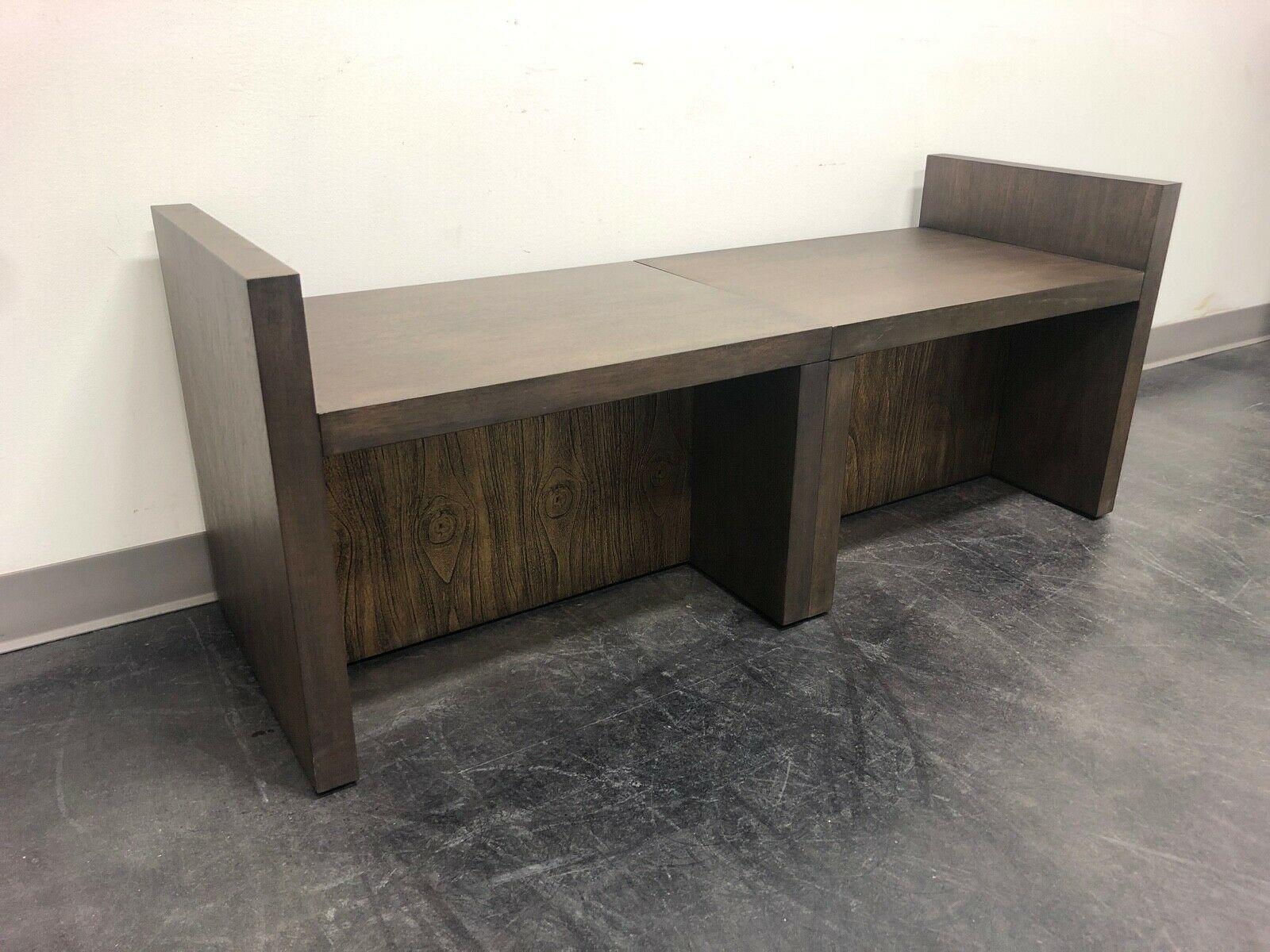 A pair of contemporary benches designed by Kara Mann for Baker Furniture, for their Milling Road line. Walnut. Simple cushions can be made to complement your existing decor. Made in the USA.

Baker Model #:  MR 7016

Measures:  Overall: 26w 18d 21h,