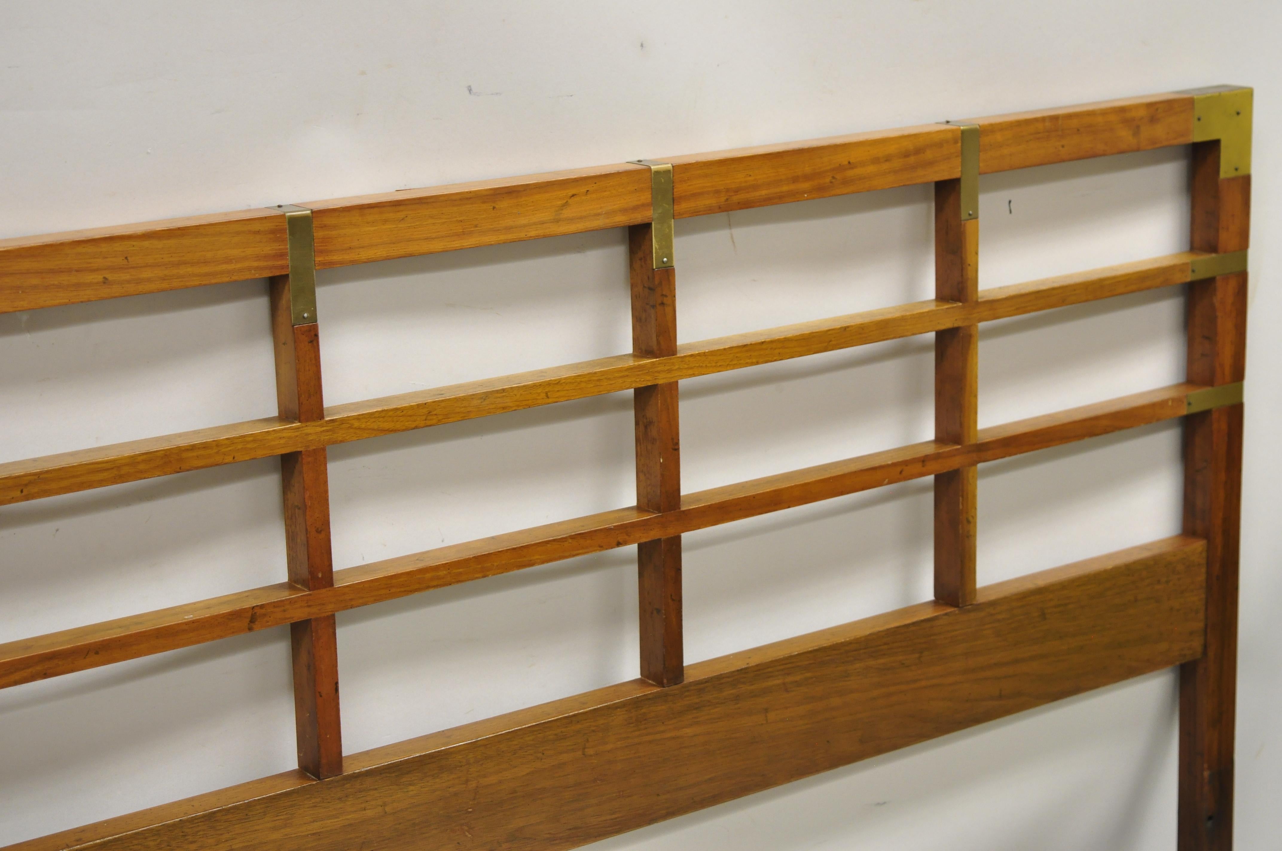 Baker Milling Road Campaign Style walnut lattice and brass king size bed headboard. Item features solid wood construction, beautiful wood grain, solid brass hardware, very nice vintage item, quality American craftsmanship, great style and form.