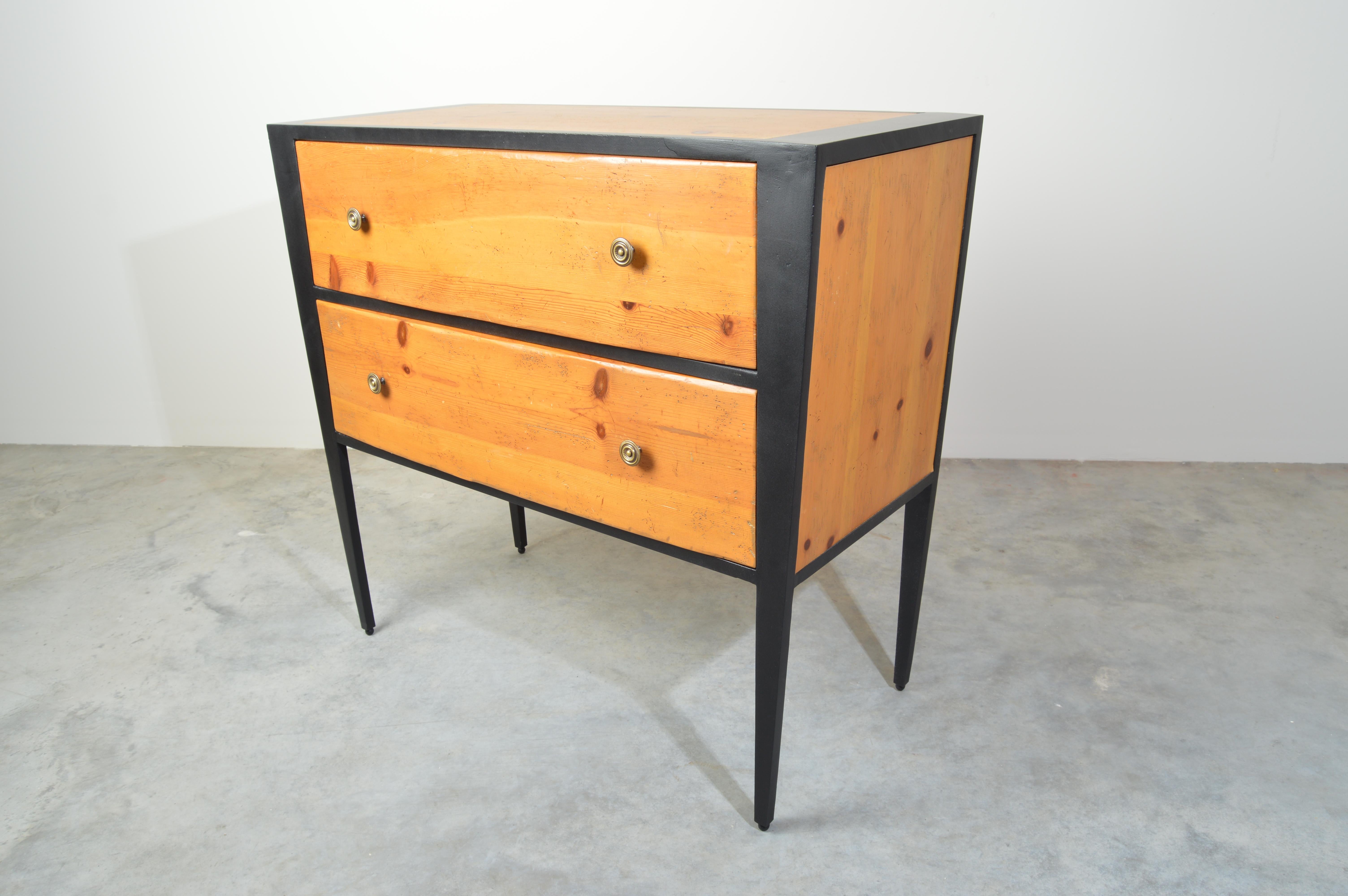 An attractive blend of modern Industrial and Classic American design having a lacquered steel frame with wormwood pine drawers and top. Original label inside the top drawer. 
 Beautiful overall condition. Clean and ready for use.