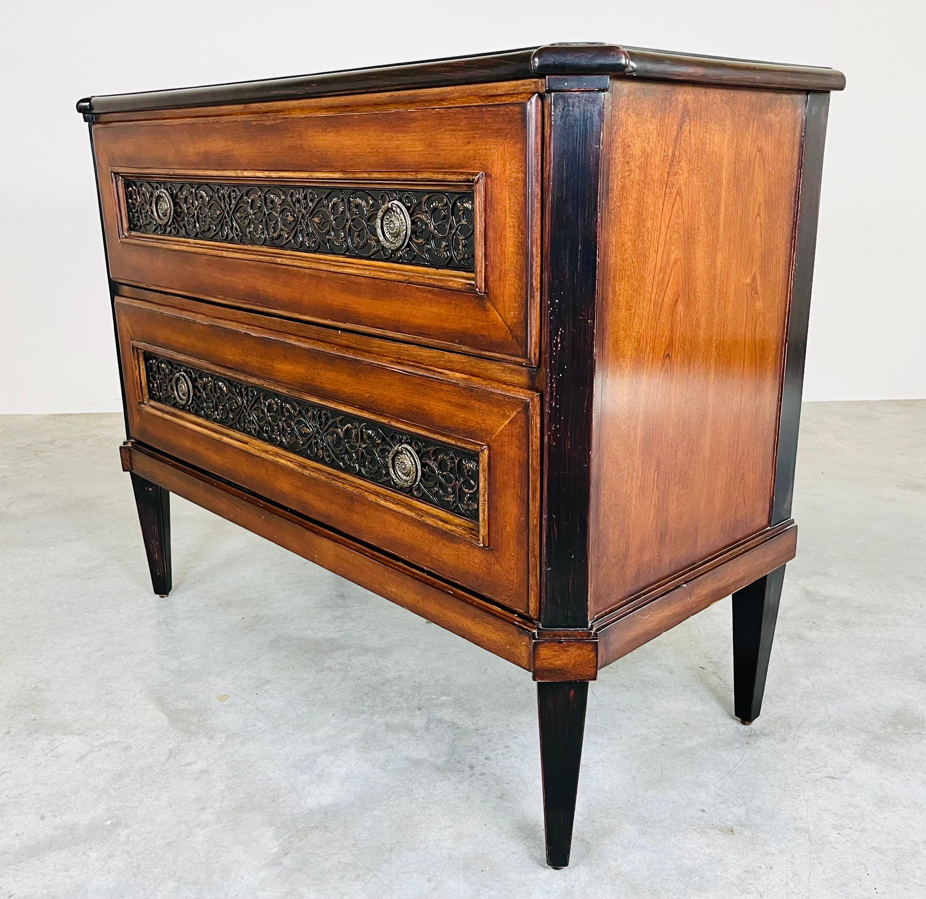 Baker Milling Road French Country 2 drawer cherry and burlwood commode chest of drawers or dresser having solid wood construction with beautiful wood grain throughout and drawer fronts adorned with baroque brass details. Original Baker label plate