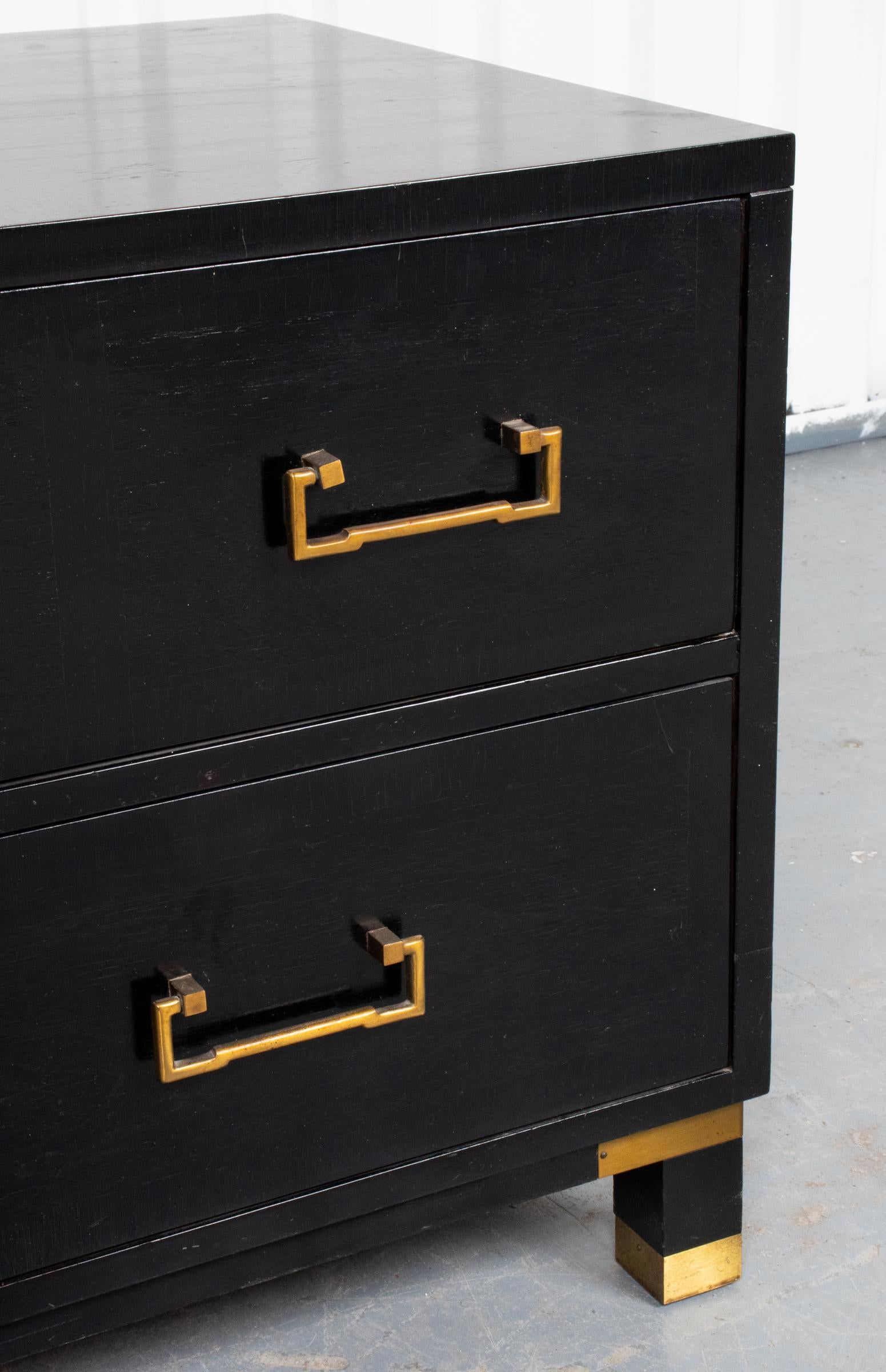 Milling Road Furniture for Baker Furniture Inc. modern ebonized low chest of two drawers, brass swing pulls and mounts. Measures: 21.5