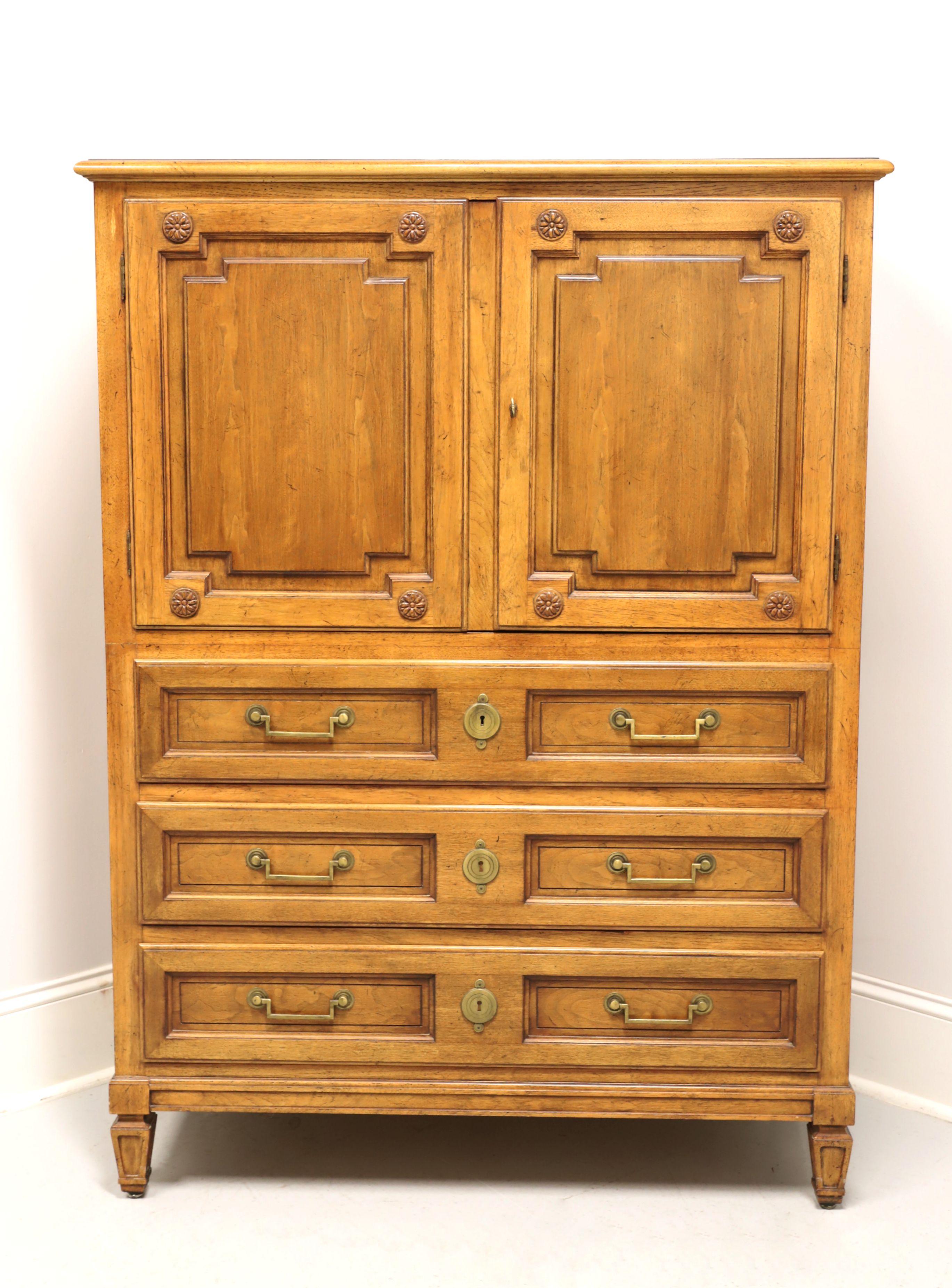 A classic Mid Century style gentleman's chest by Baker Furniture Company, for their Milling Road Division. Walnut with slightly distressed finish, banded top, brass hardware, raised door panels & drawer fronts, and spade feet. Features upper