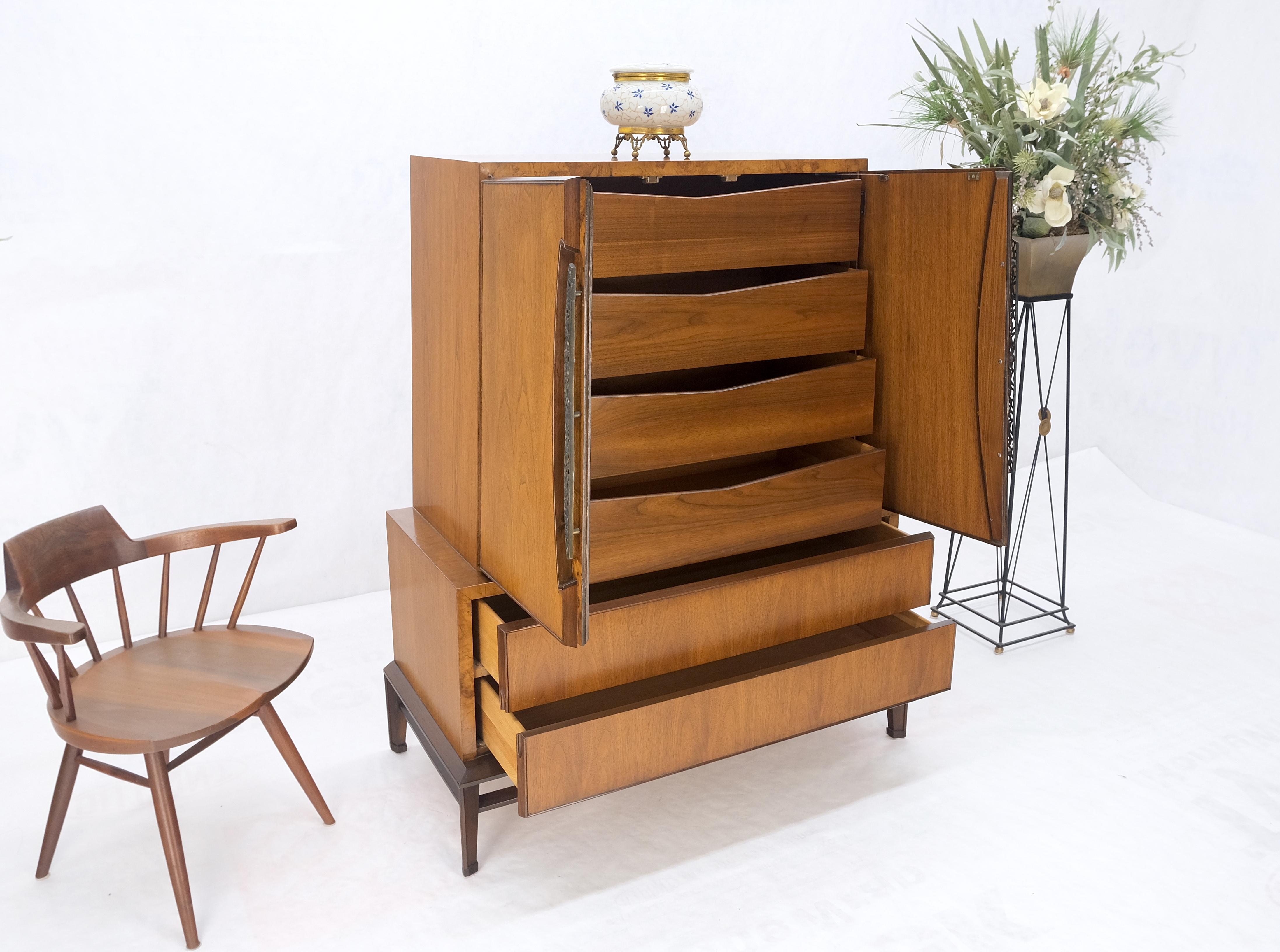 Baker Modern Light Walnut 2 Doors 6 Drawers High Gentleman's Chest Dresser MINT! 
Sculptural bracket shape base cast solid brass decorative hardware sophisticated mid century modern cabinet by major cabinetmaker.