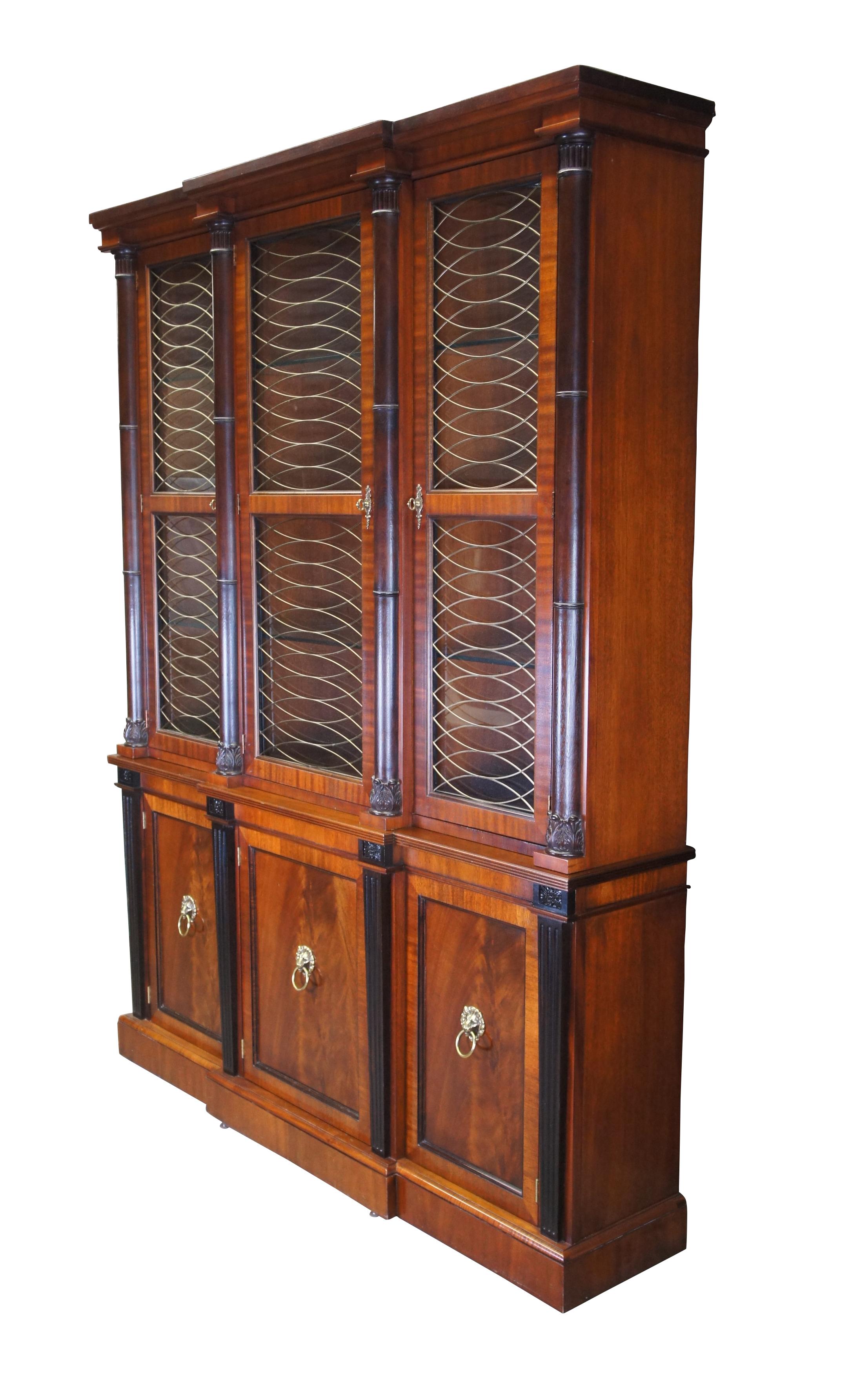 Exceptional Baker Furniture Company China Cabinet, circa early 2000s.  Inspired by English Regency, Neoclassical and French Empire styling.  A rectangular form with breakfront design made from mahogany with flame (crotch) mahogany lower door fronts.