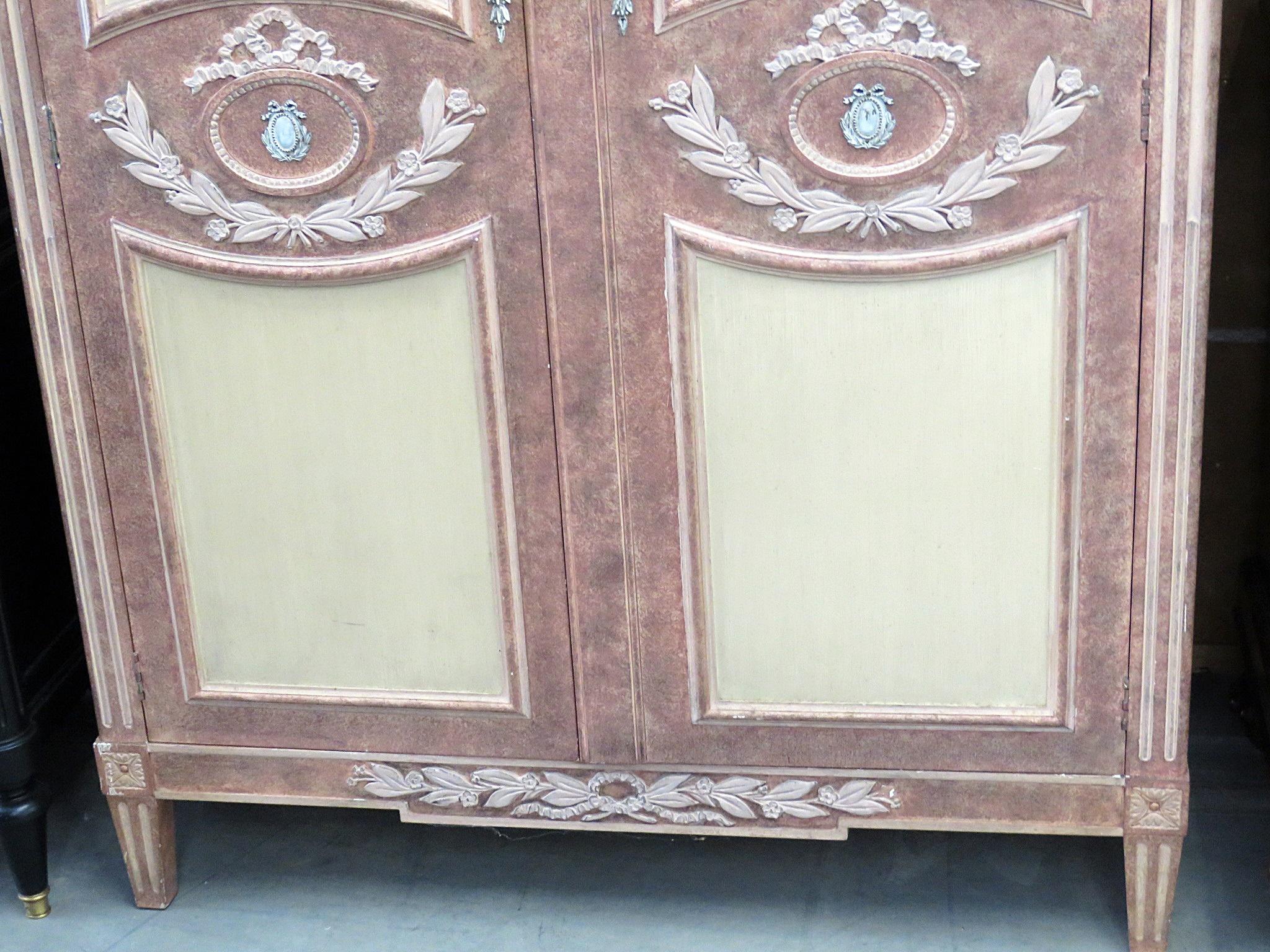 Baker neoclassical style paint decorated 2-drawer armoire with 2 shelves, 3 compartments and 3 drawers inside.