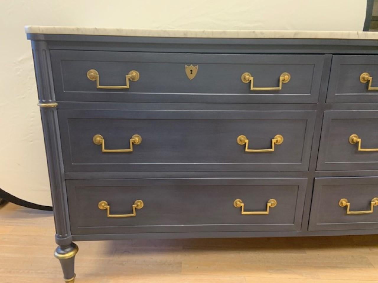 Baker oxford navy lacquered six drawer marble top brass hardware dresser. This is a beautiful clean piece some vintage wear and tear - dovetailed, original brass hardware - original marble top - white with gray veining. Painted in our design and