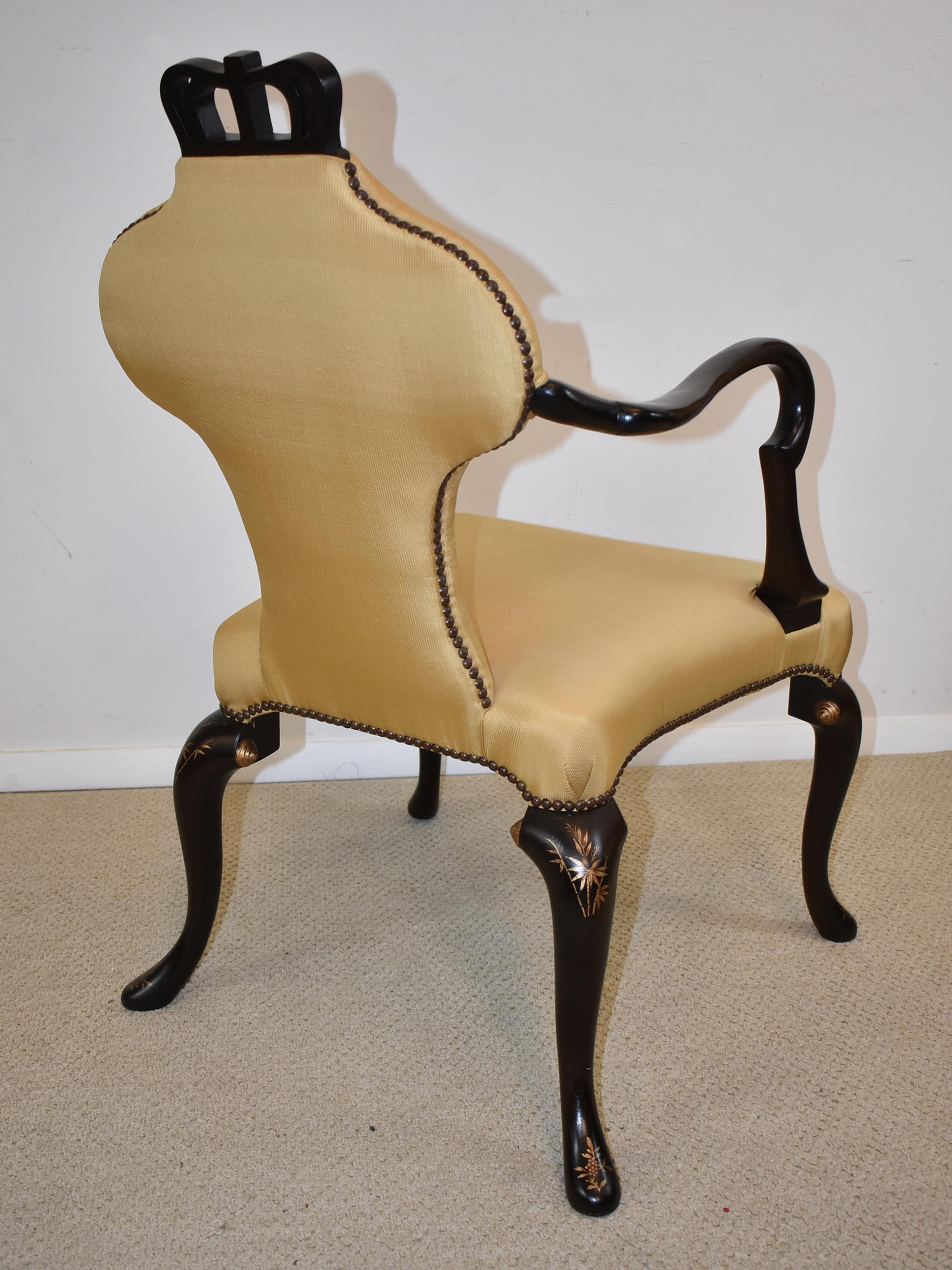 Baker Queen Anne armchair from the Stately Homes Collection 5139. A Queen Anne chair with an upholstered back in lieu of a splat. Elongated shepherd's crook arm. Distinctive cabriole legs, with unusual splayed back legs. Nail trim. The chair has an
