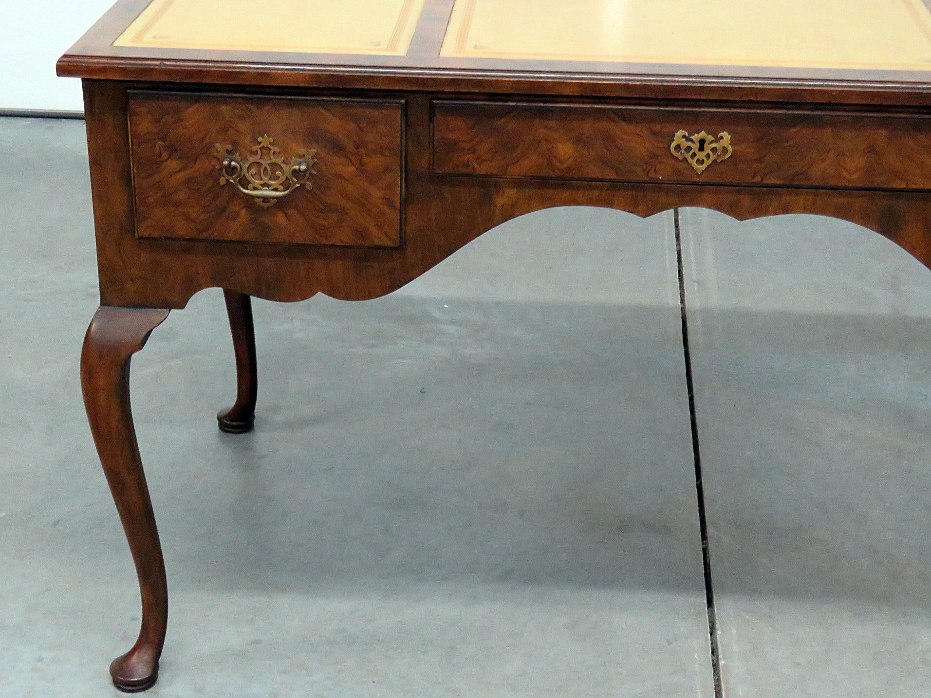 This is a Baker Queen Anne style leather top 3 drawer desk with beautifully burled walnut and a cornflower yellow leather top. This is a superb desk and will be in professional detailed condition before delivery.