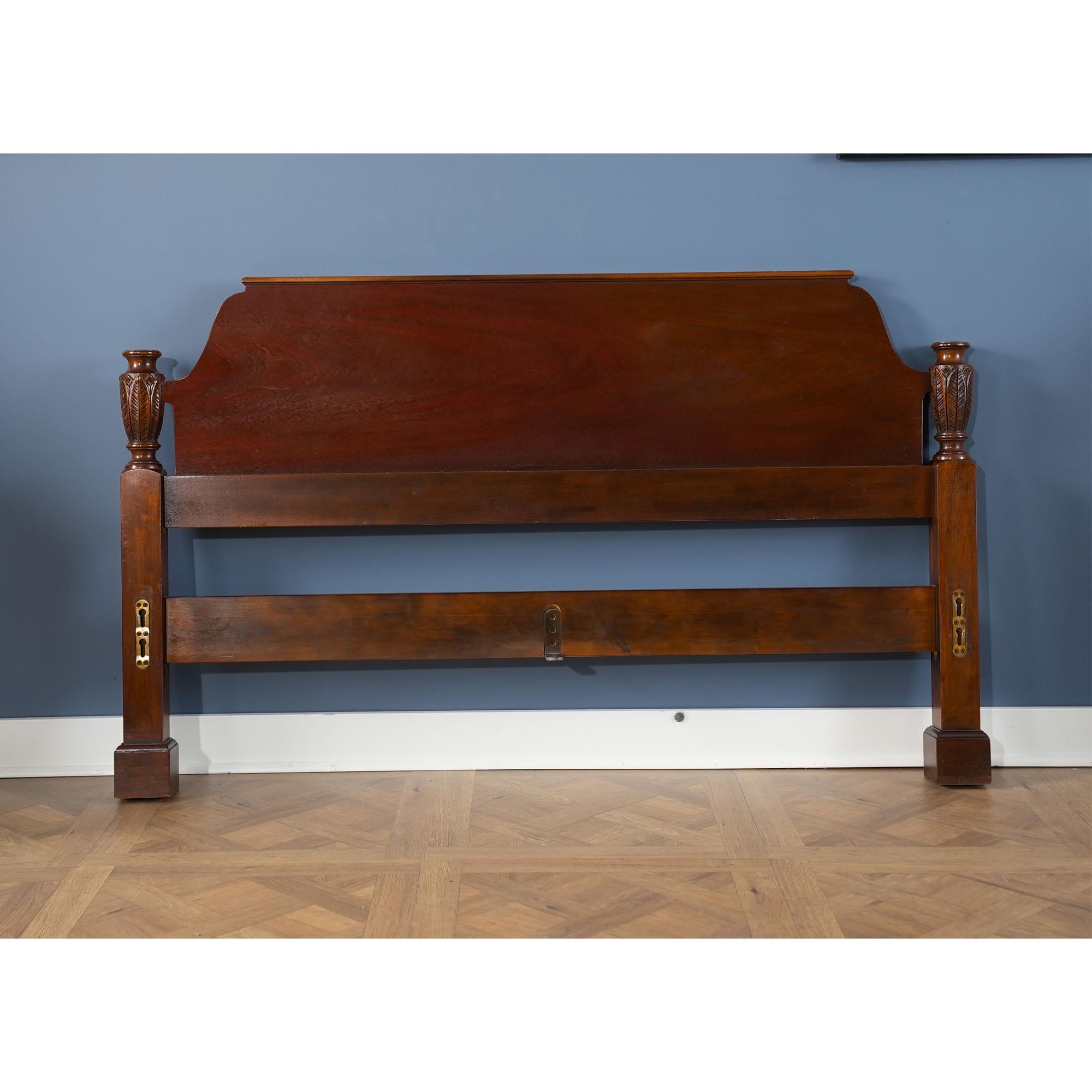 A vintage Baker Queen Size Mahogany Poster Bed which will be the focal point of any bed room in which it is placed. From the beautifully tapered finials and posts all of the way down to the solid square legs this bed has a great traditional look